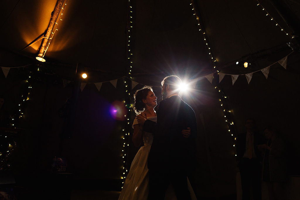 evening wedding pictures in a tipi