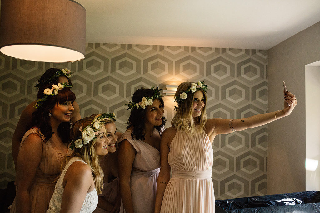 bride and bridesmaids wearing flower crowns from didsbury flower lounge in manchester