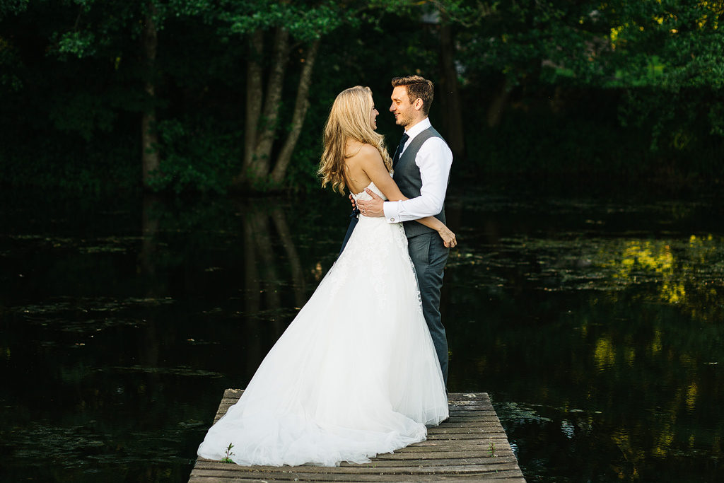 beautiful couple on a jetty at their wedding