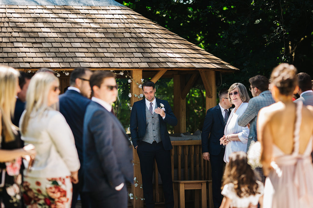 groom seeing his bride for the first time at the oak tree of peover