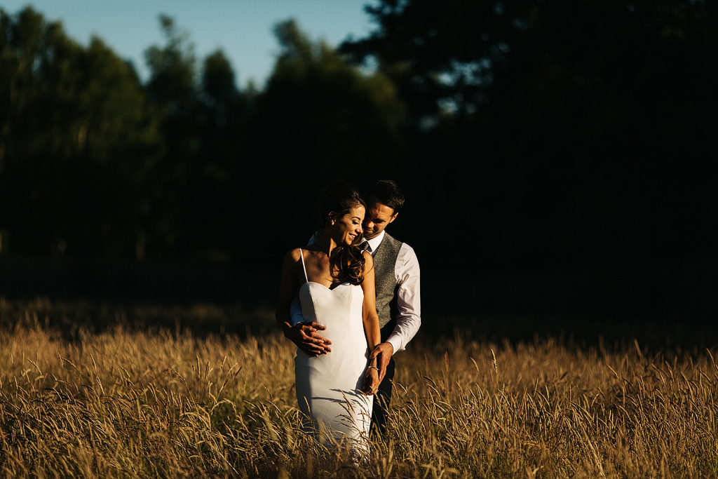 amazing pictures of a bride and groom in a cornfield