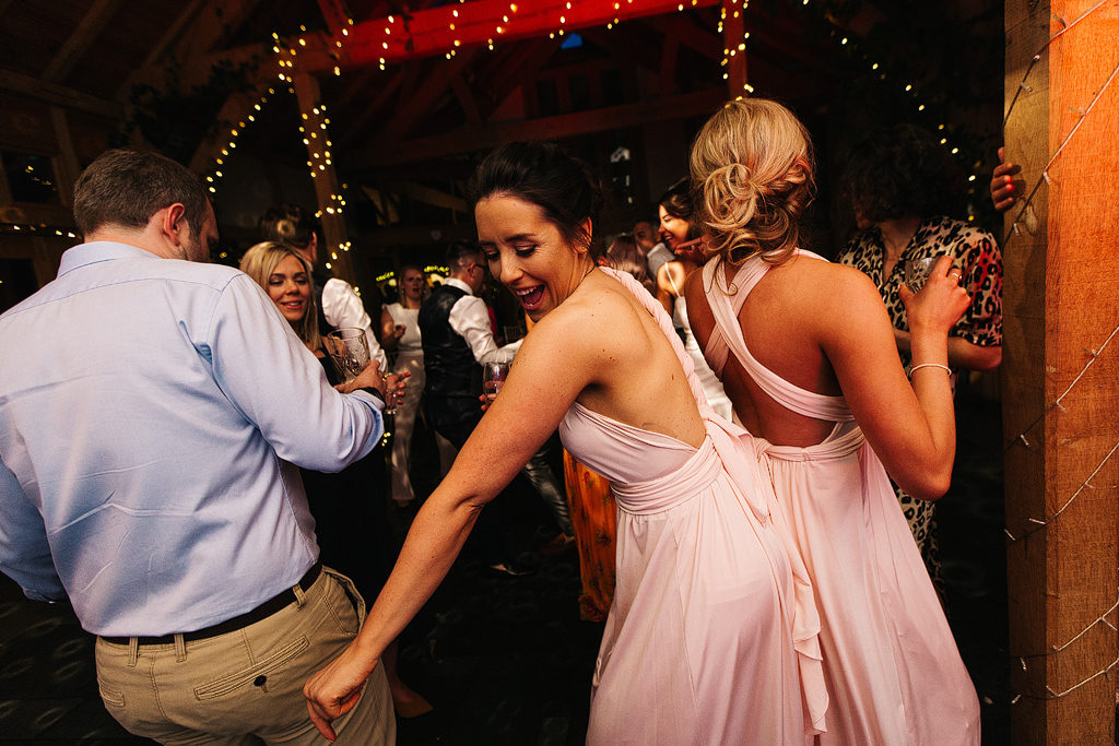 bridesmaid dancing at a fun and quirky wedding in cheshire
