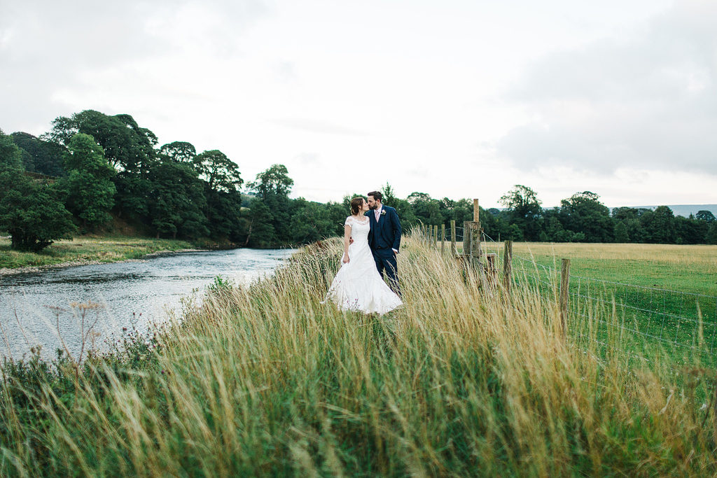 yorkshire wedding photographer with bride and groom by the river
