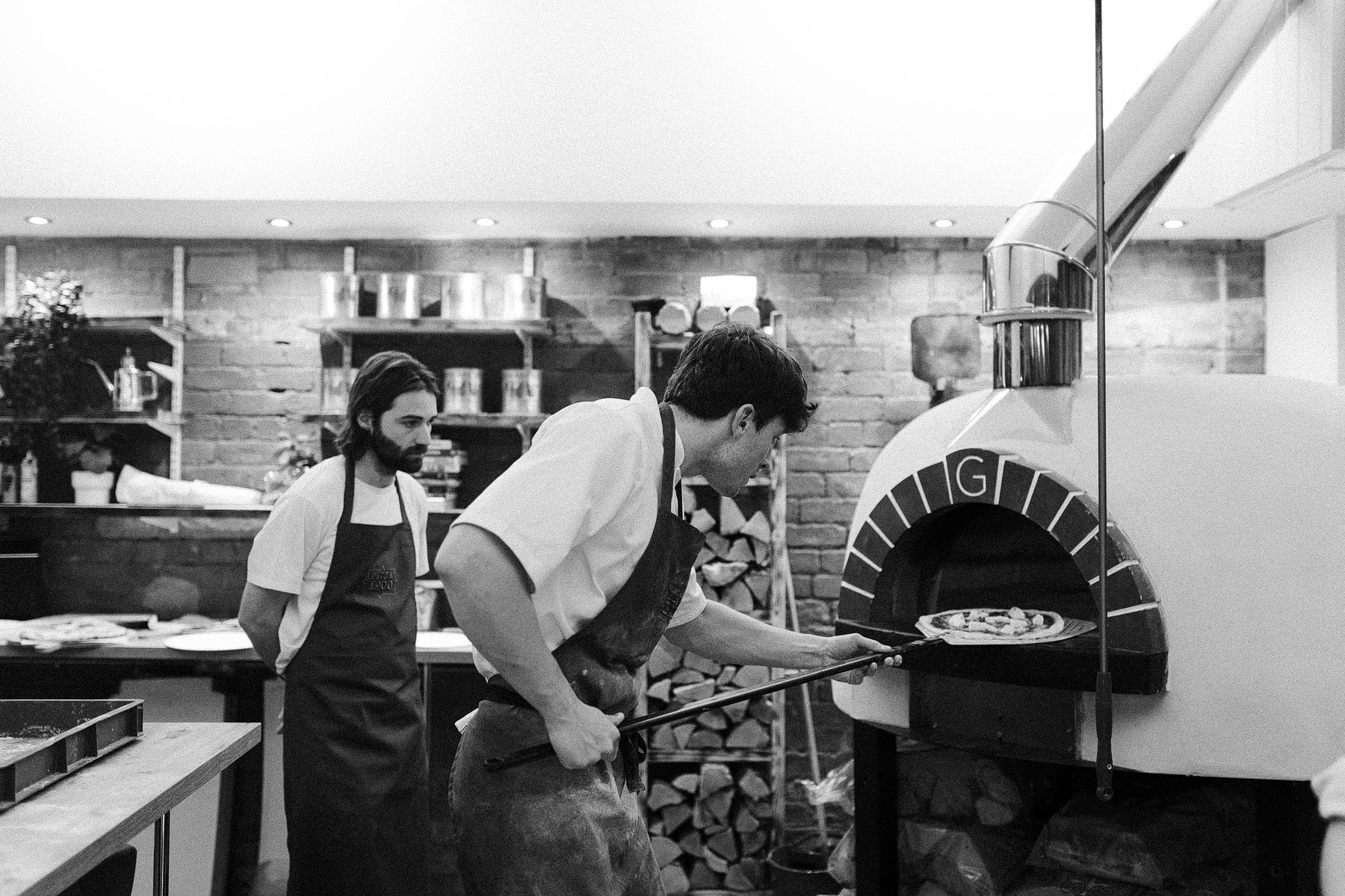 training to make pizza in a gozney pizza oven
