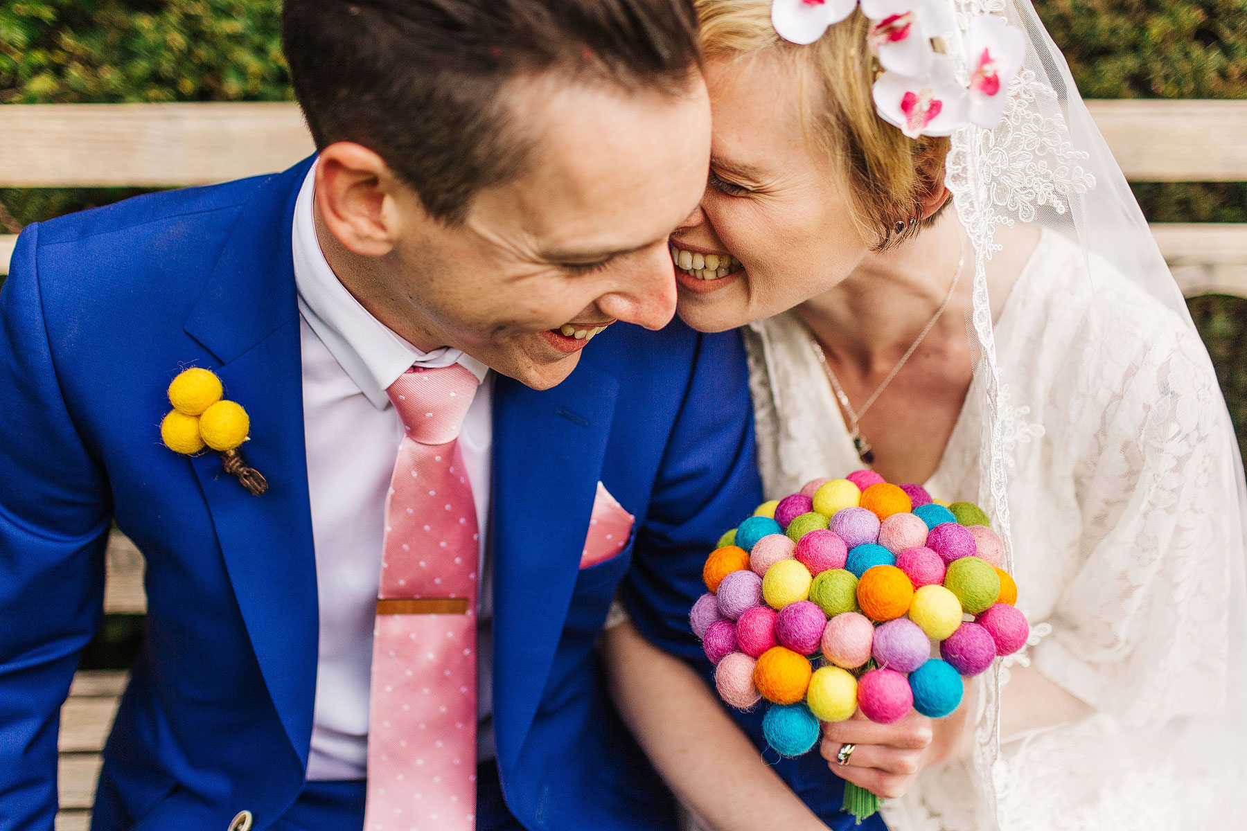 bride and groom looking colourful at broughton hall