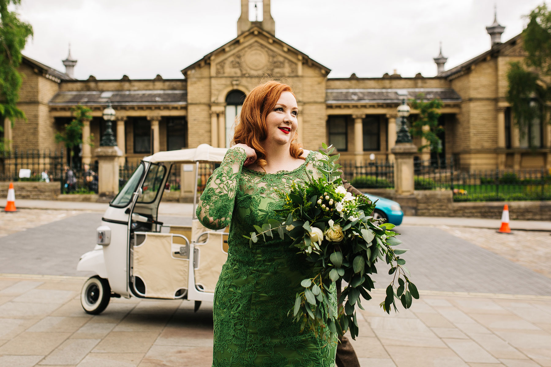 bride arriving in a tuk tuk to victoria hall in saltaire