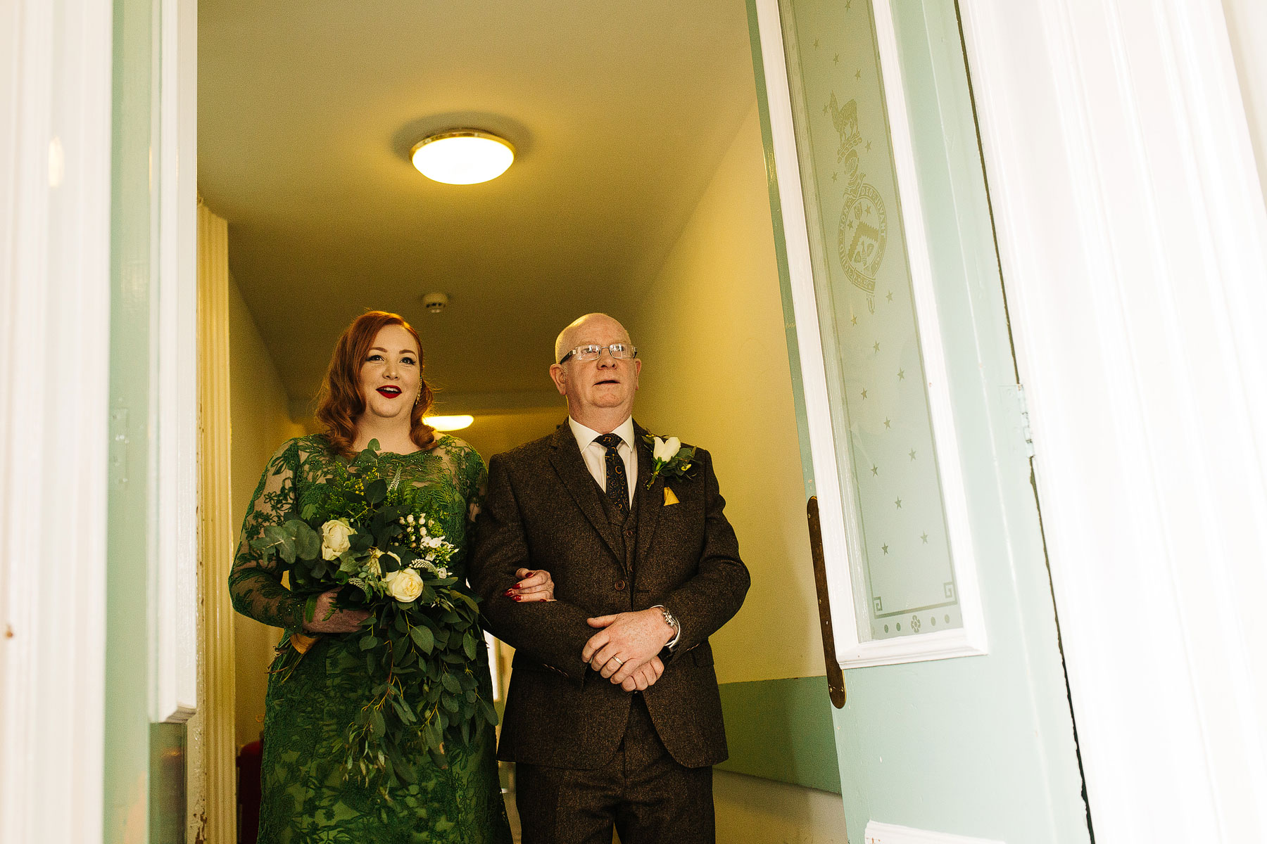 bride wearing a bespoke green wedding dress