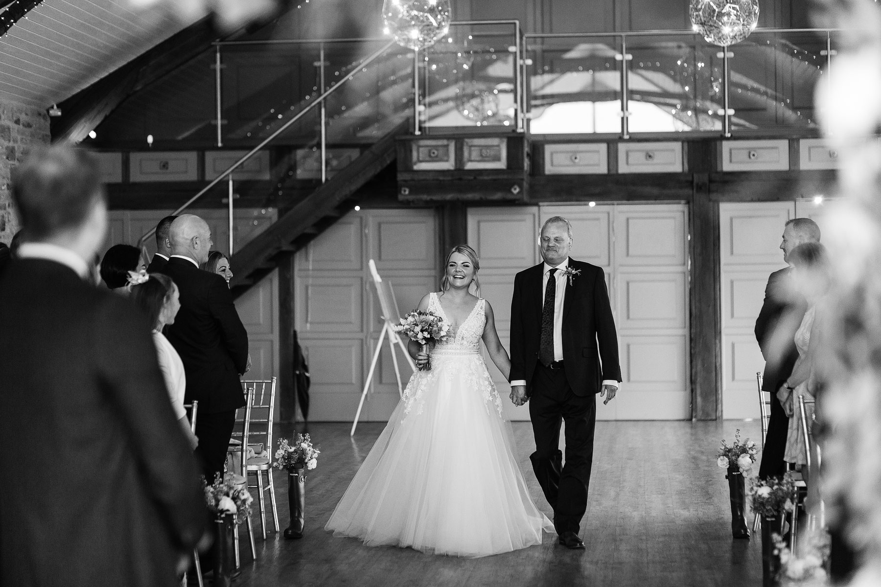 bride walking the aisle at yorkshire wedding barn