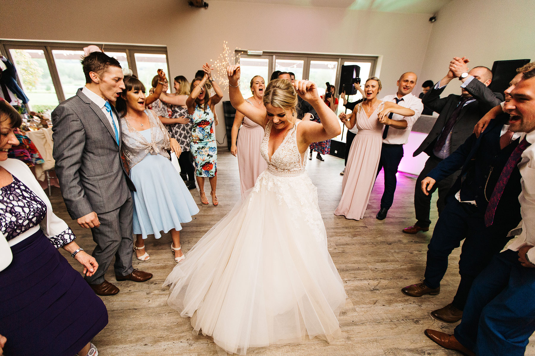 happ bride dancing at yorkshire wedding barn