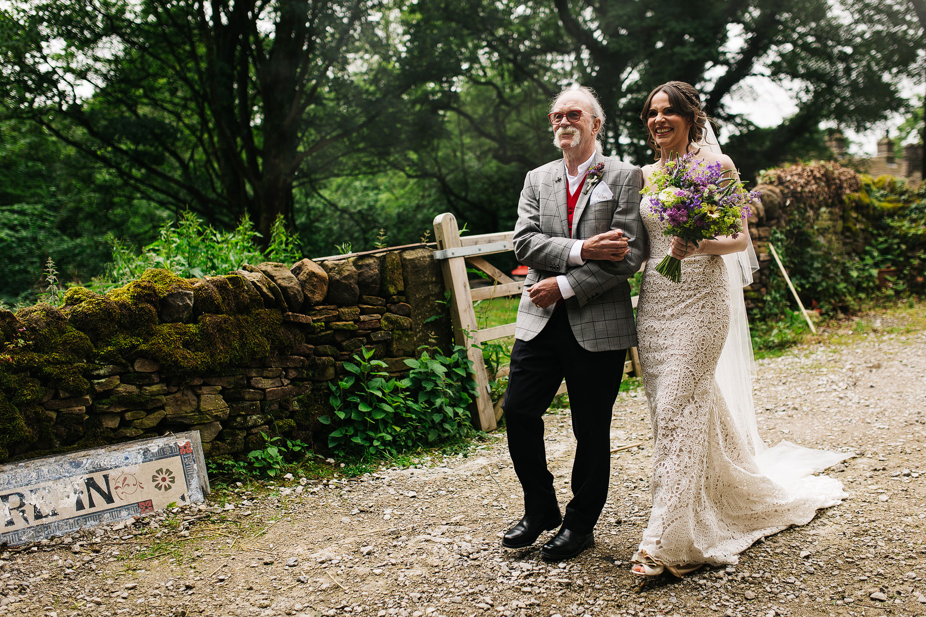 bride walking to her humanist ceremony in the peak district