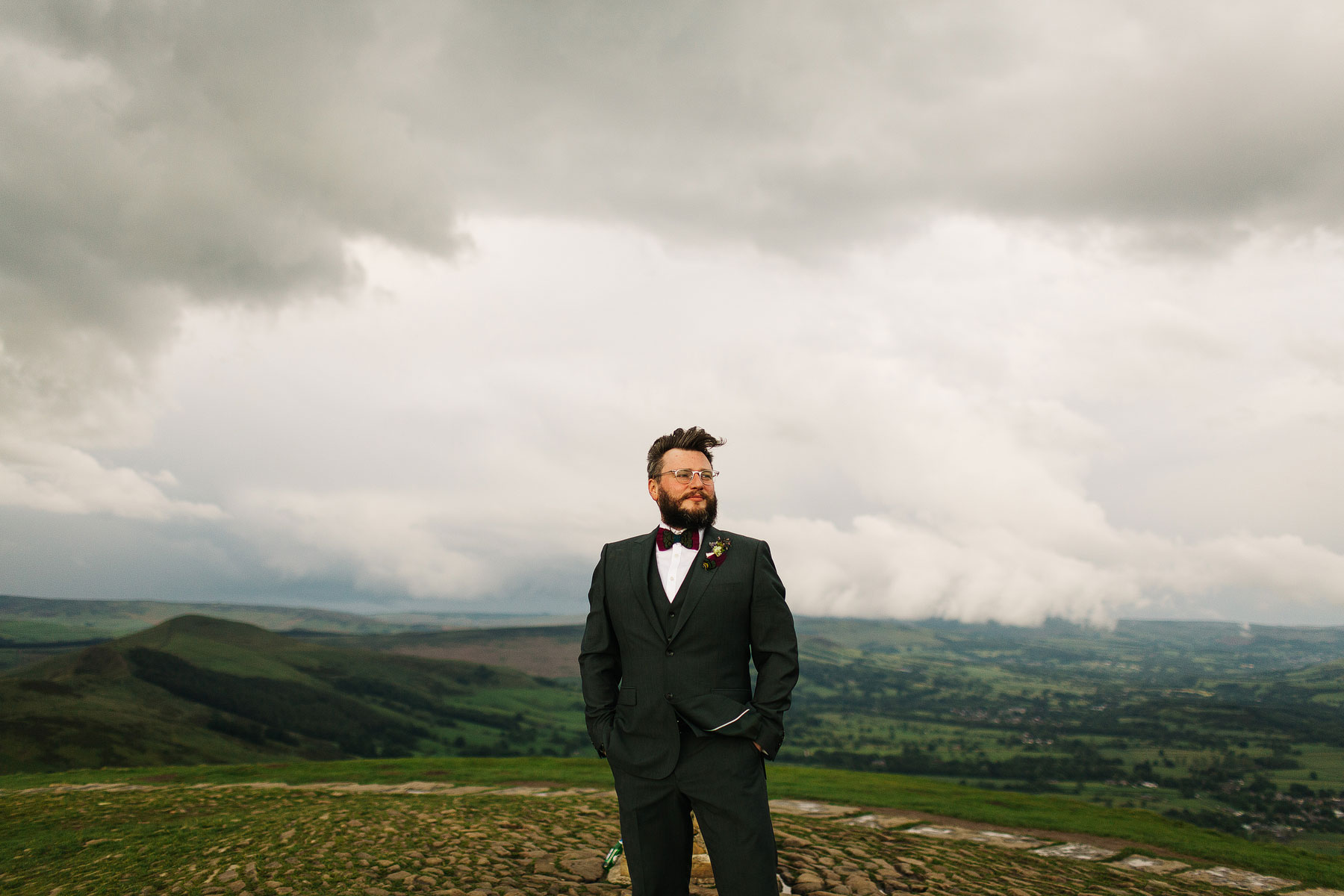 groom wearing green and a bow tie on mam tor