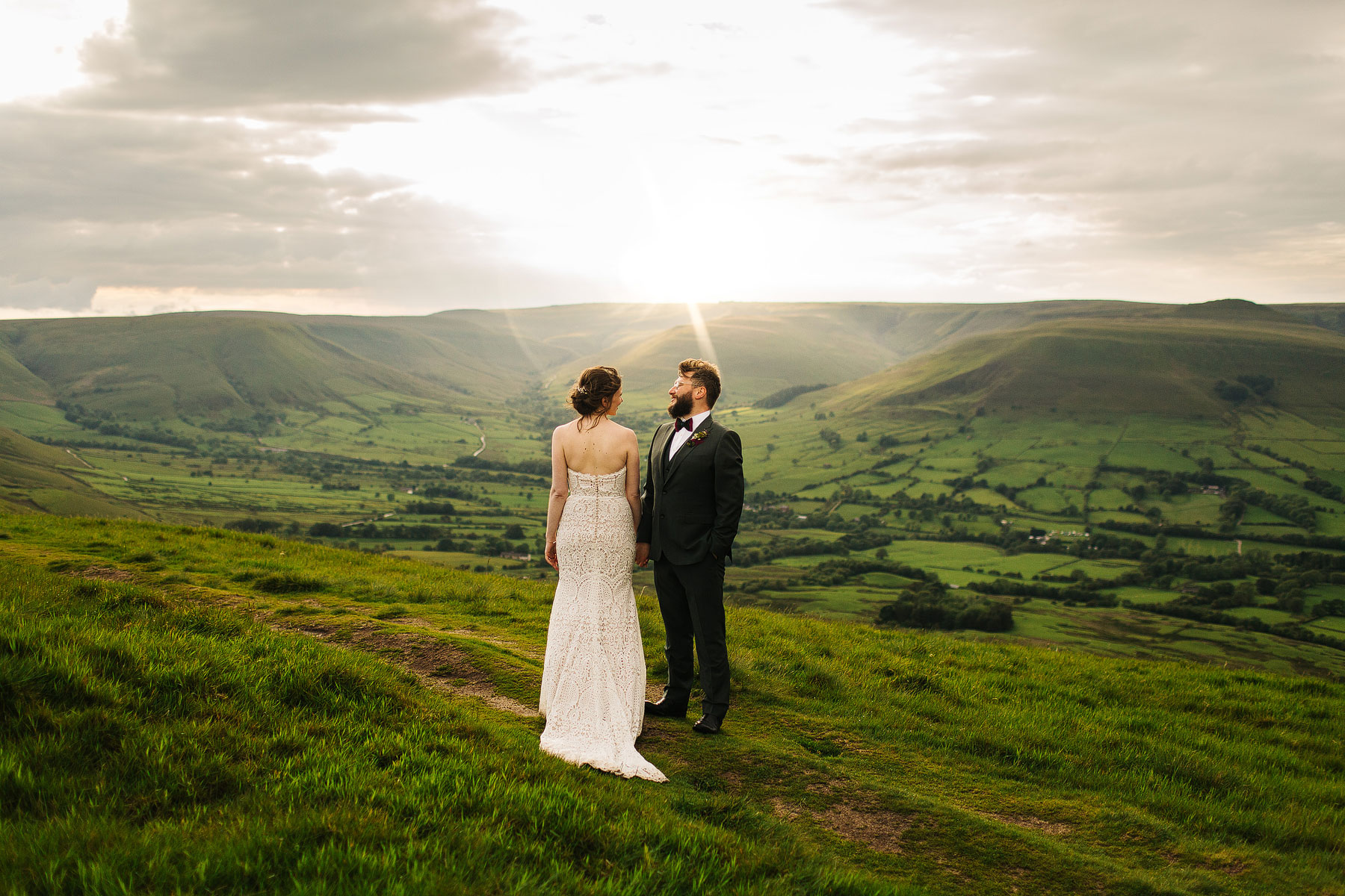 bride and groom at the top of mam tor