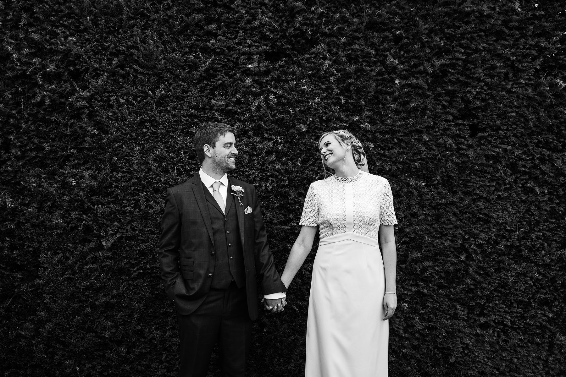 bride and groom having pictures taken at broughton hall