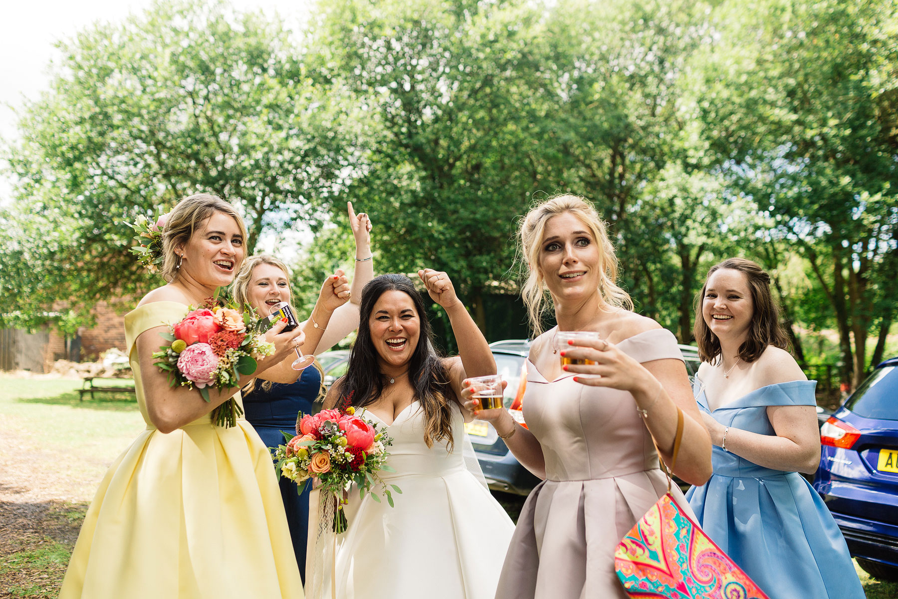 bridesmaids wearing colourful dresses