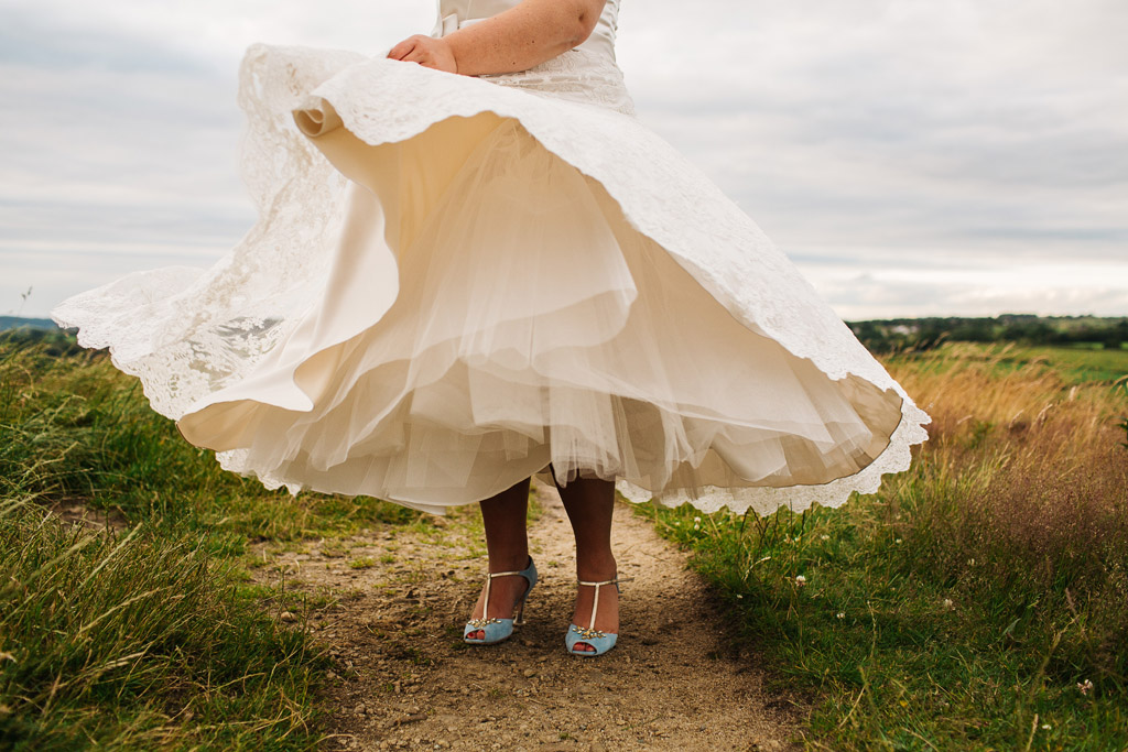 Bride twirling her tea length Dress 