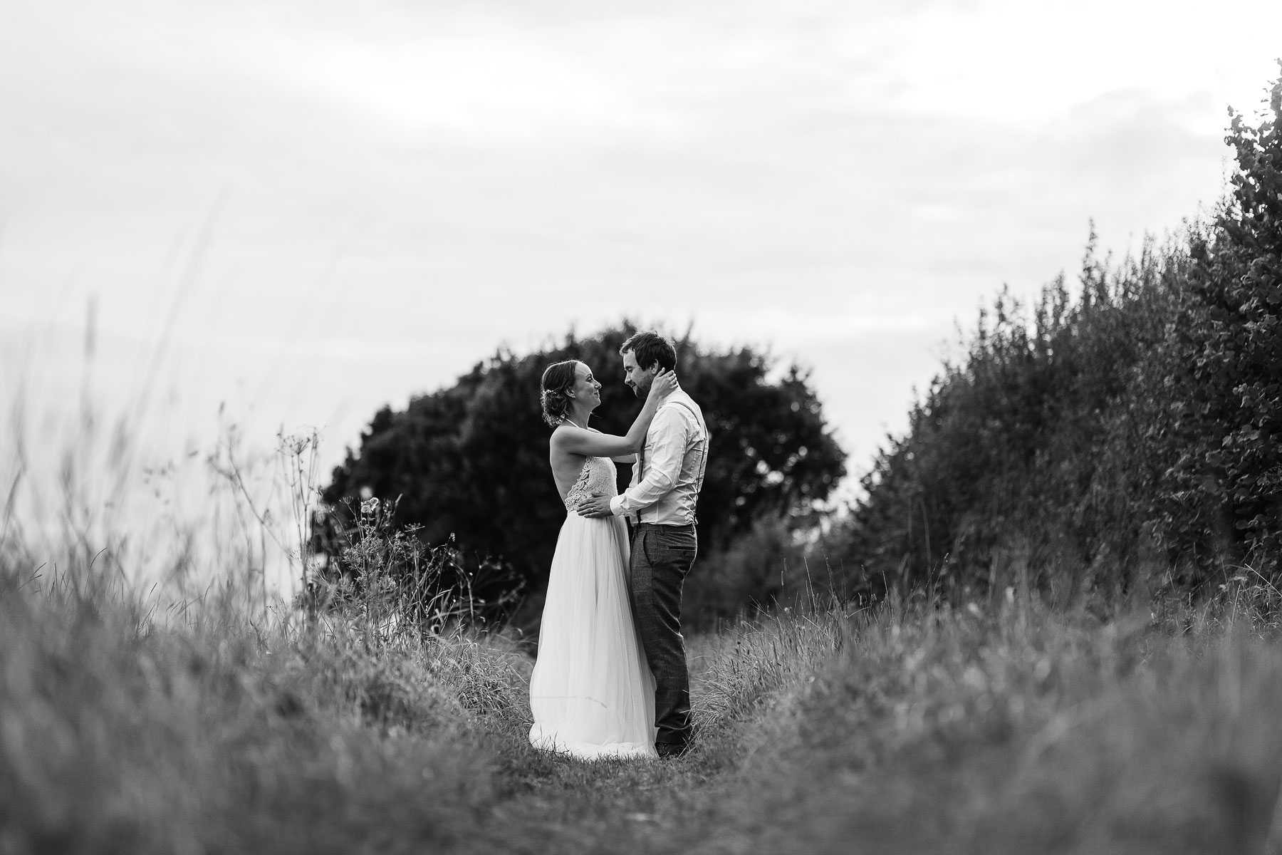 bride and groom in a field near york