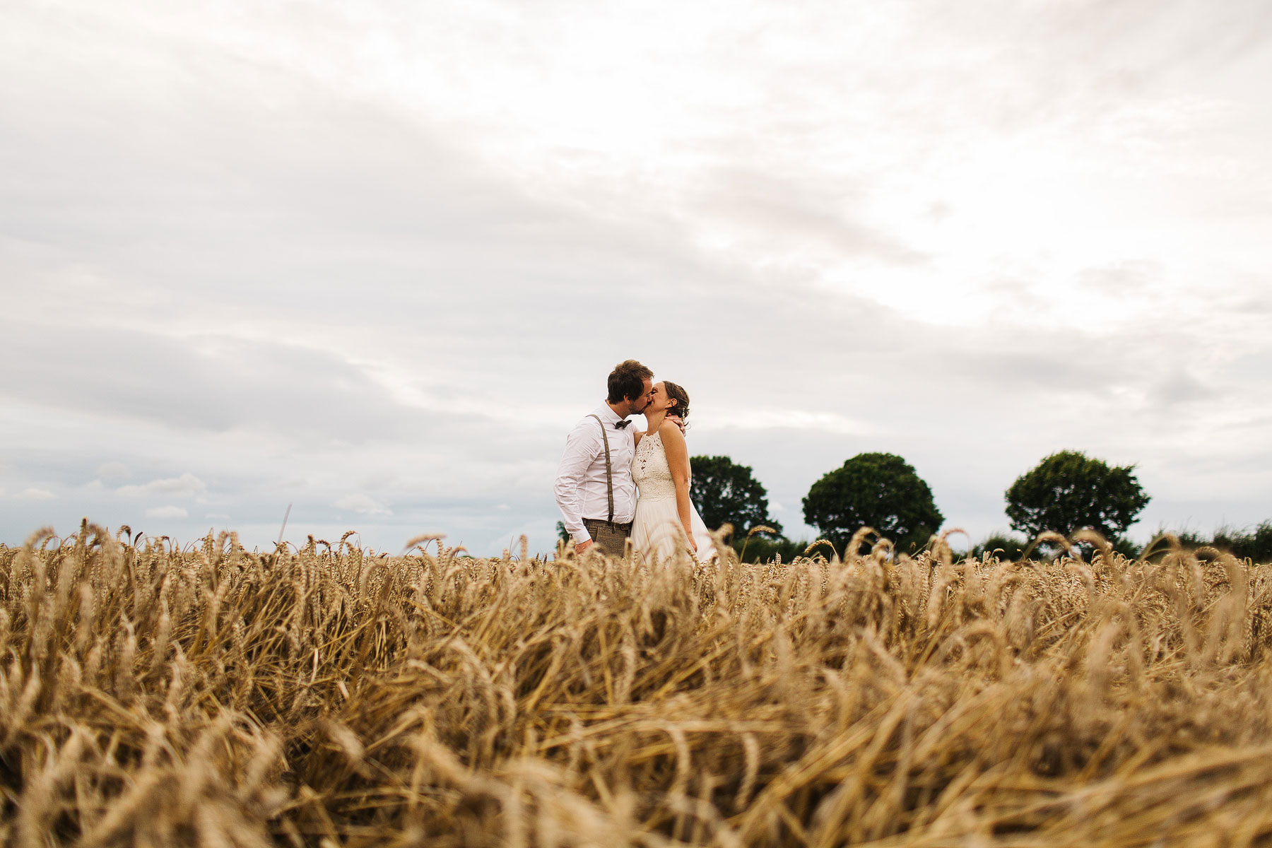 bride and groom in corn in york north yorkshire