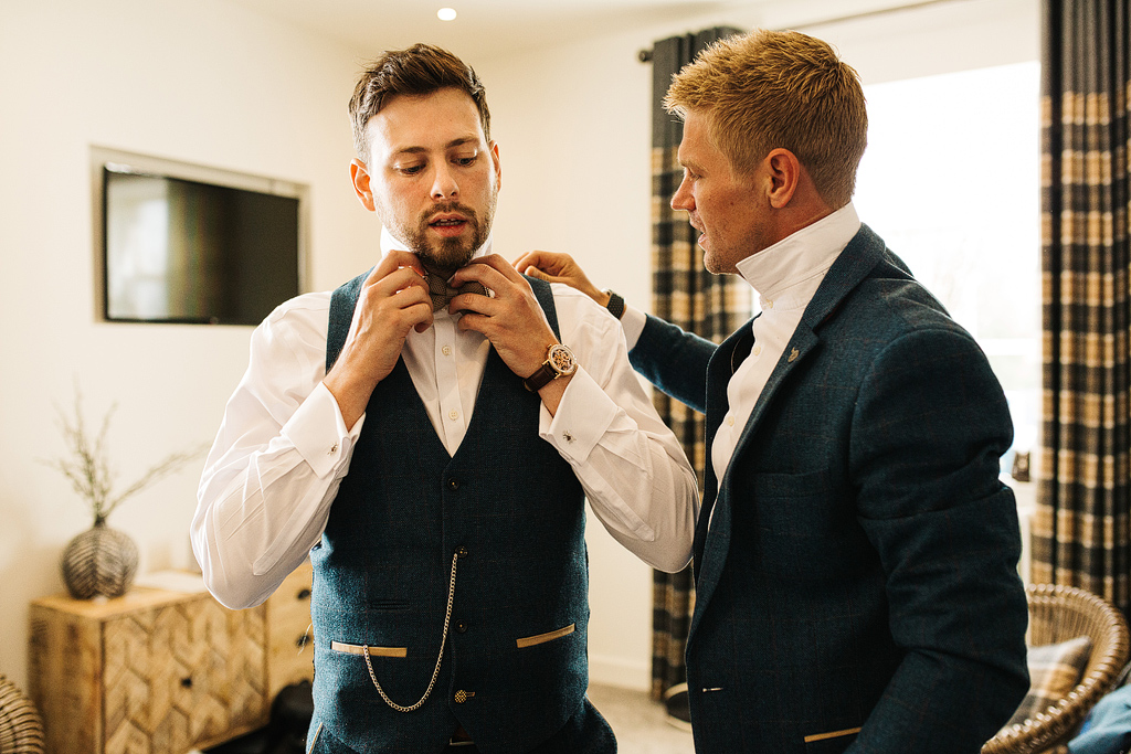 groom wearing a marc darcey suit at holmes mill in clitheroe