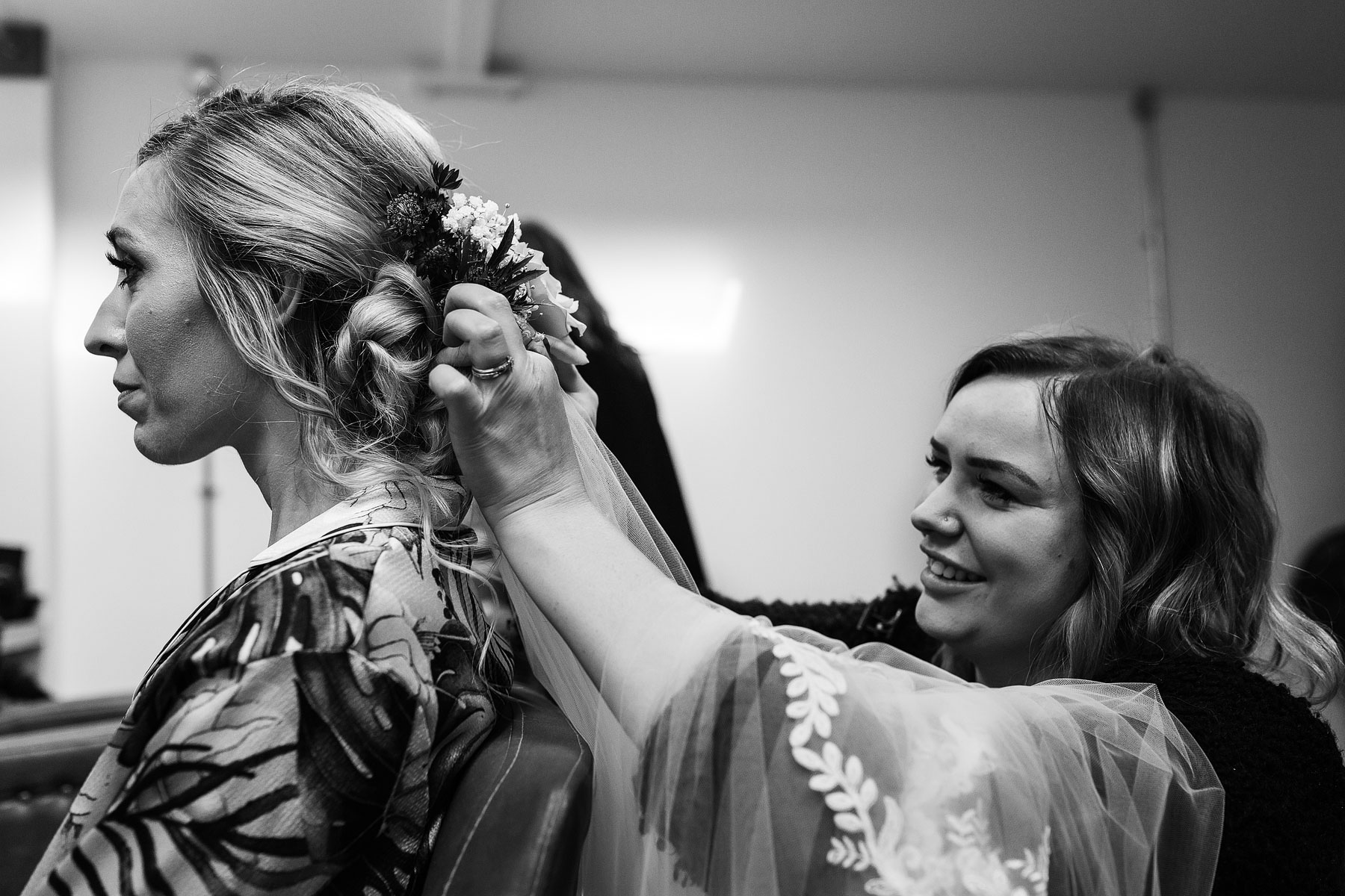 bride having her hair done for her manchester barn wedding