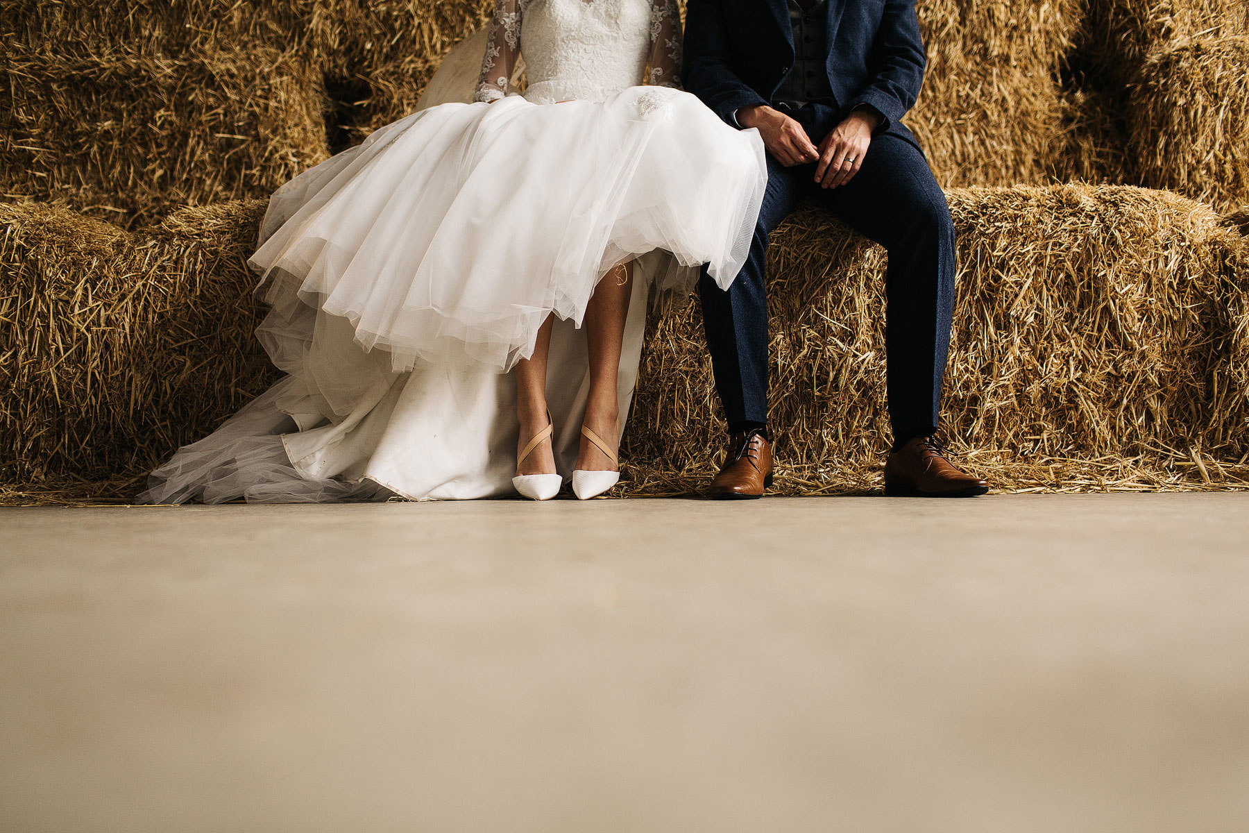 bride and groom quirky wedding photo in a barn