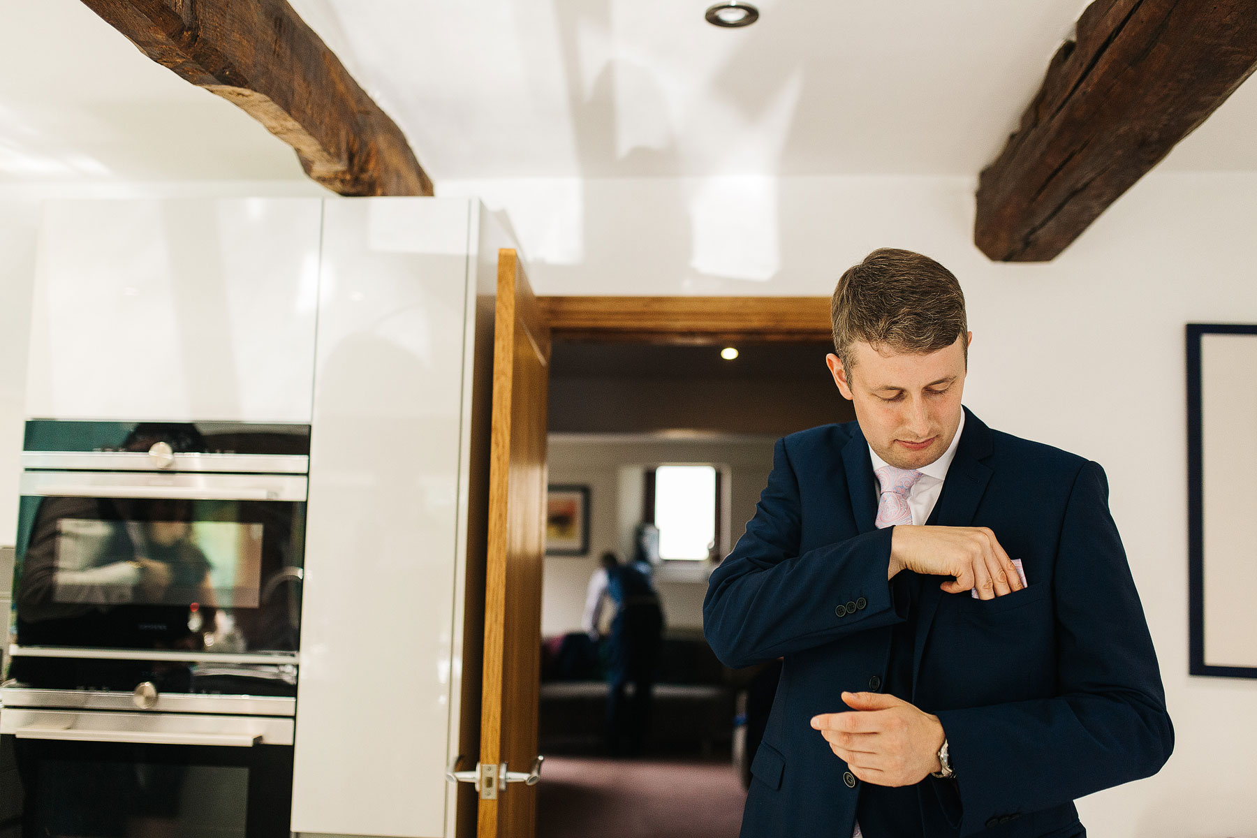 groom getting ready for his tithe barn wedding in bolton abbey