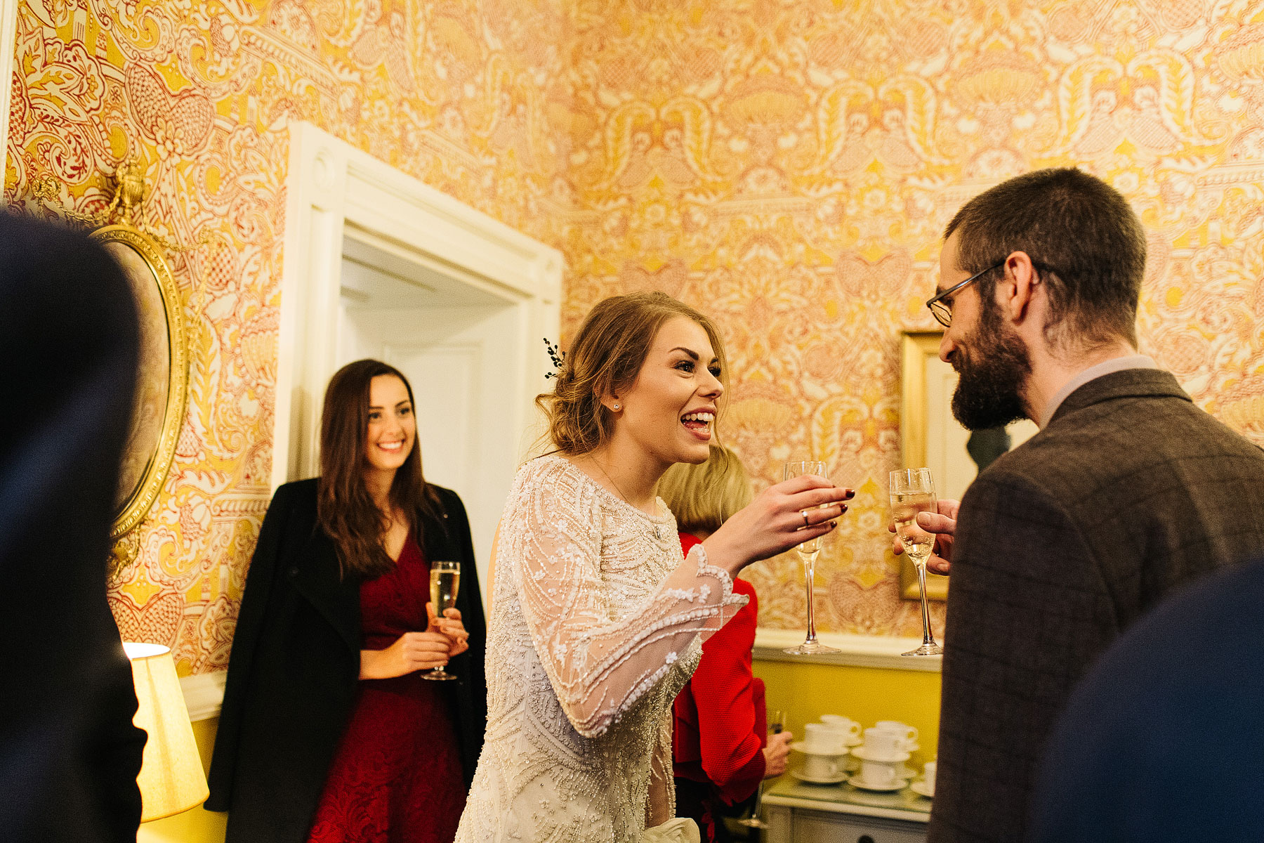 happy bride chatting to guests at her silverholme manor wedding