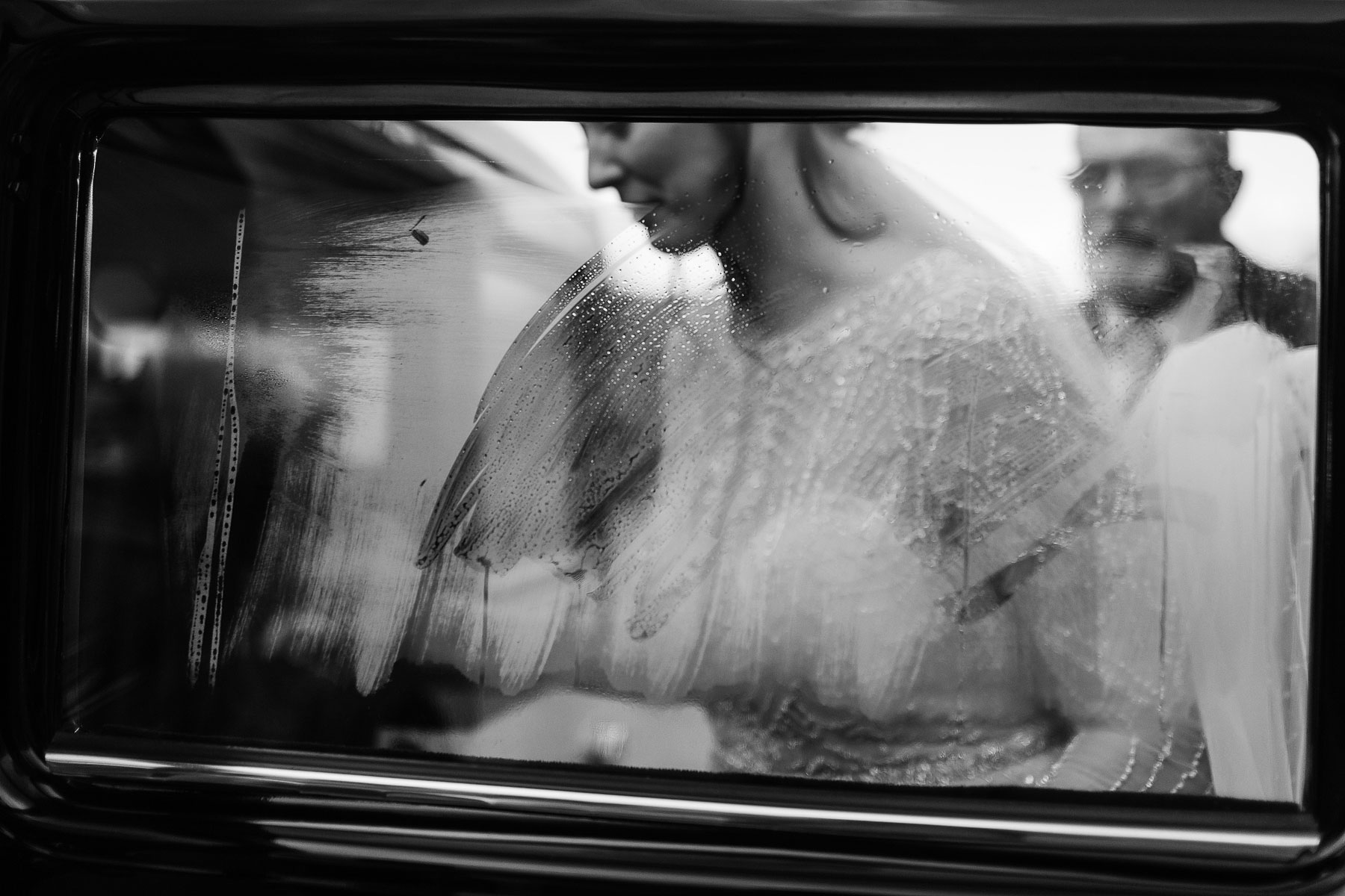 creative image of a bride getting into wedding car