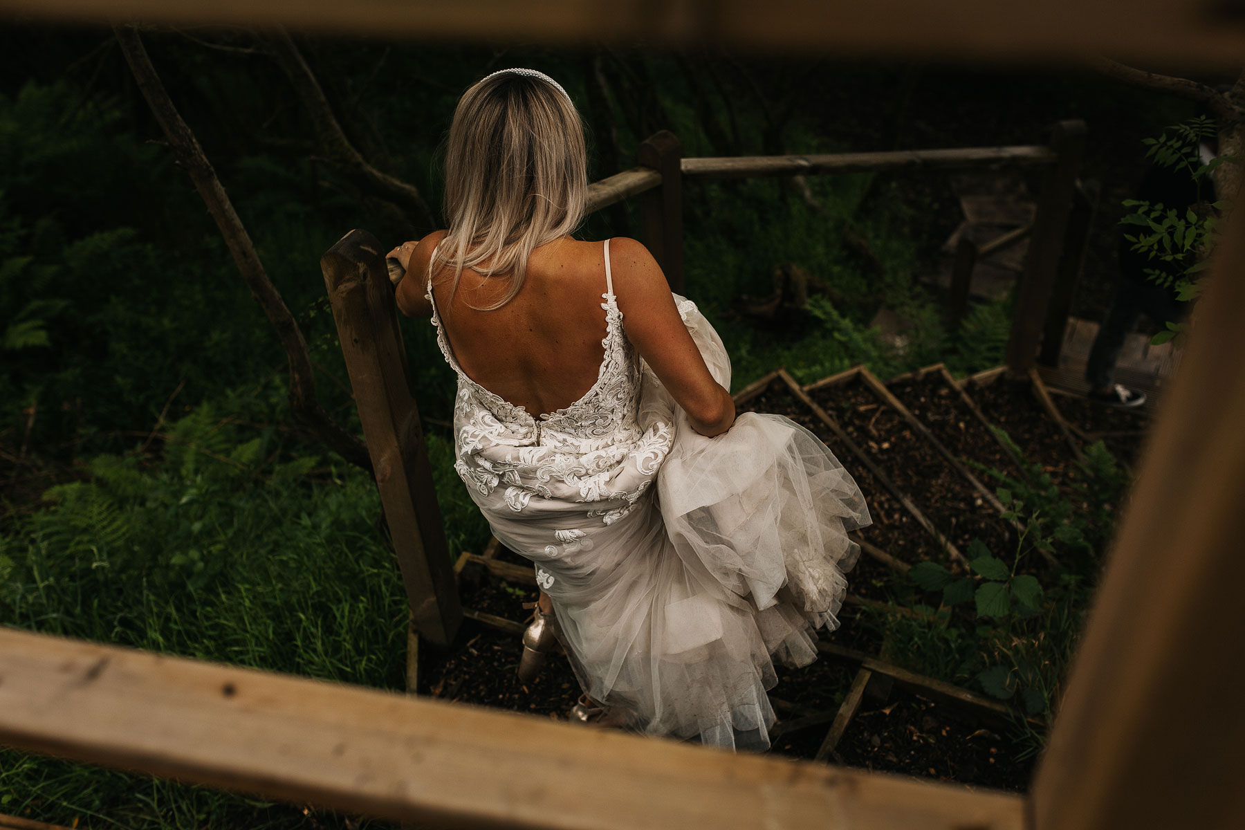 bride walking to falling water on the ponden mill estate