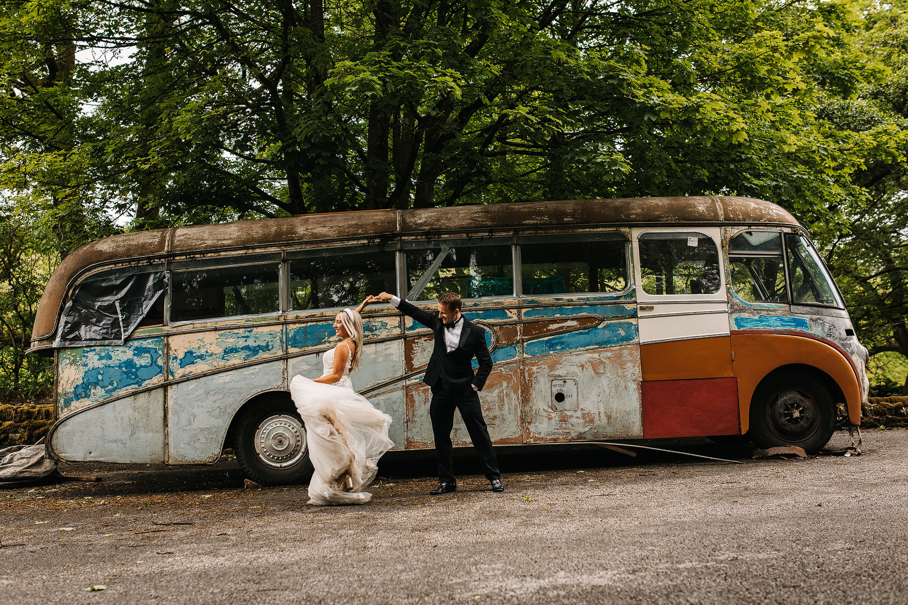 cool picture of a bride and groom in front of an old bus