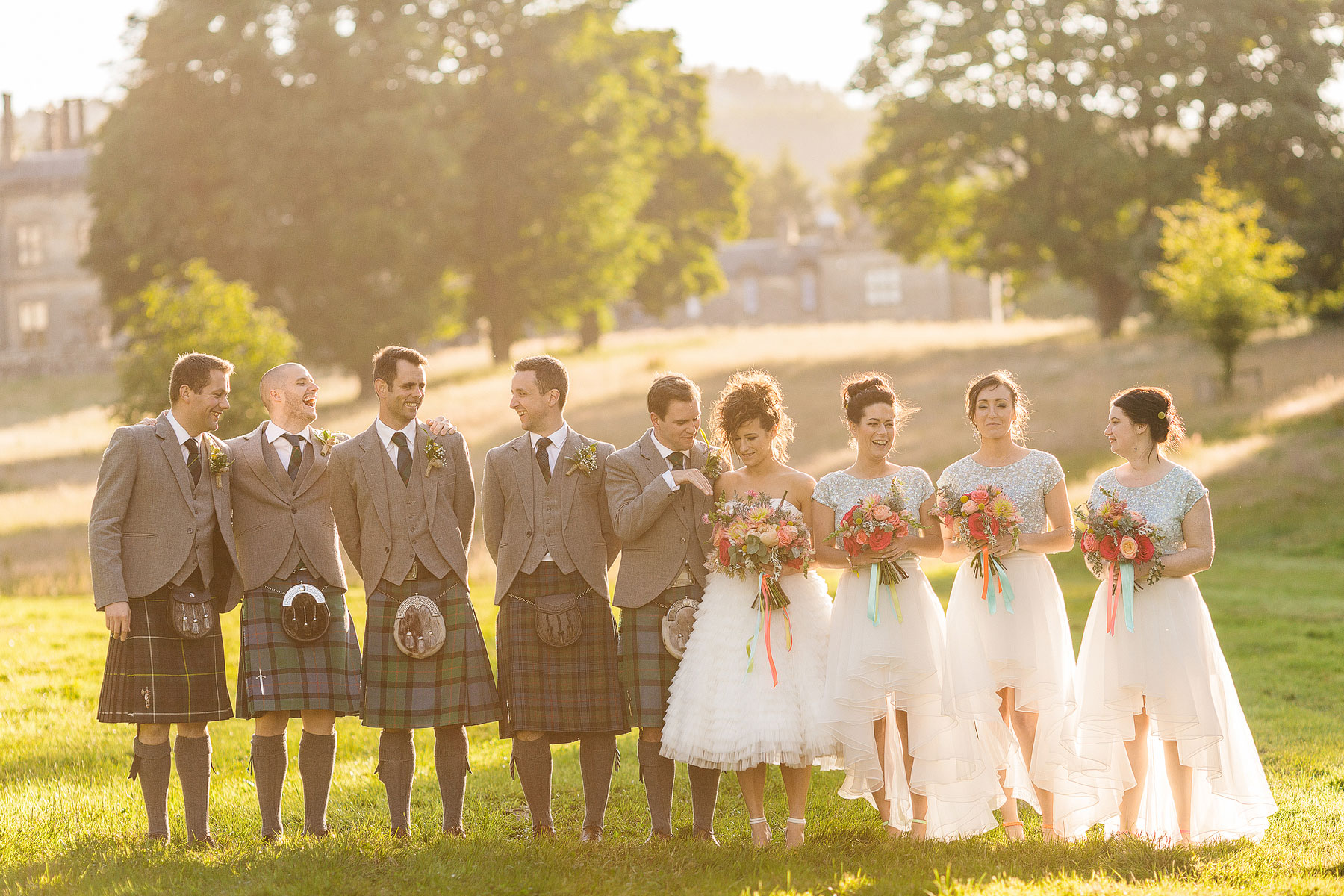 informal wedding photos of a bridal party in pastel colours 