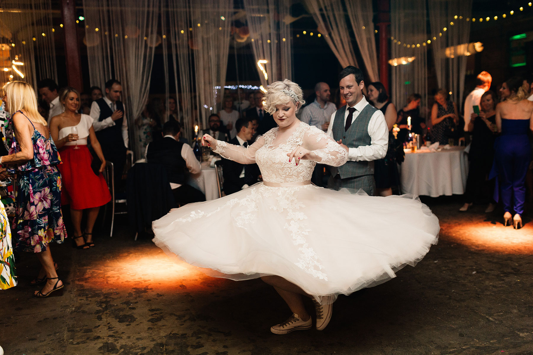 bride wearing a mooshki dress spinning around on the dancefloor in leeds