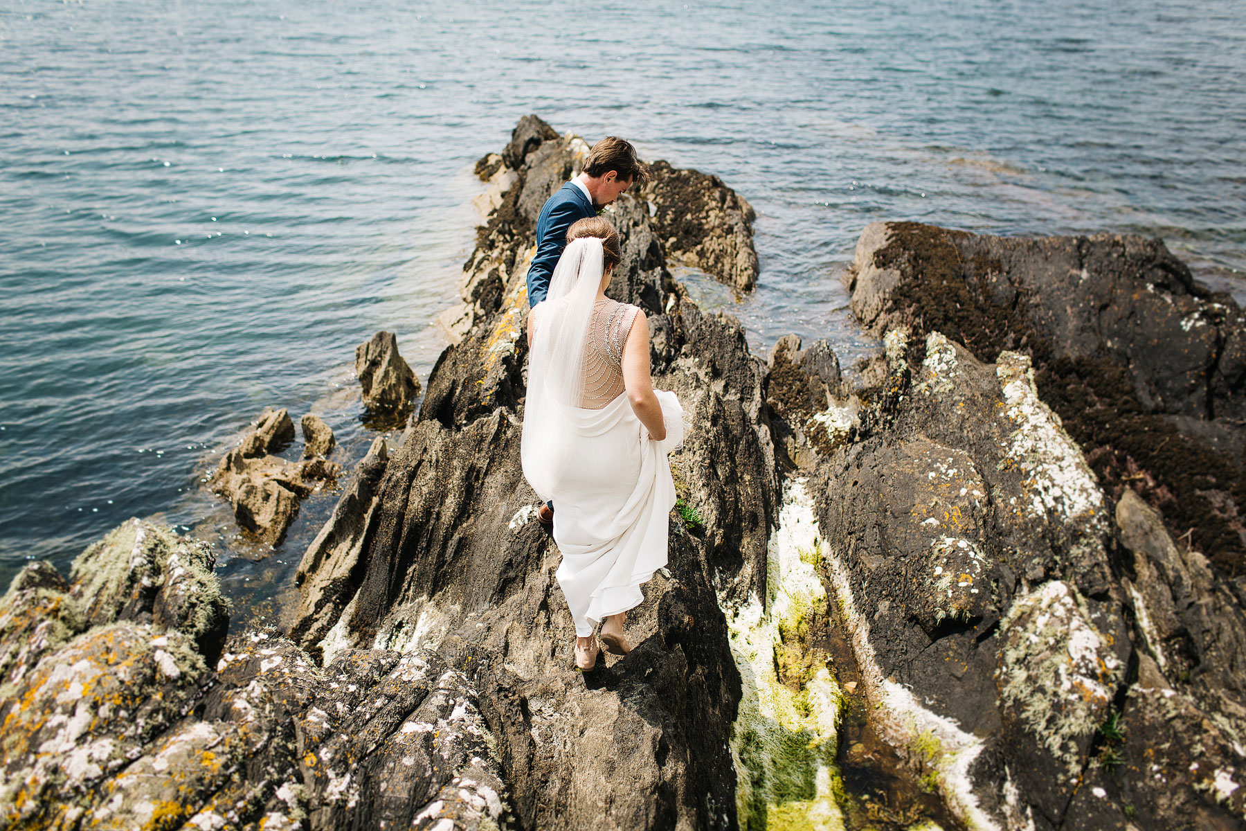 bride and groom at parknasilla for their beach wedding on the rocks