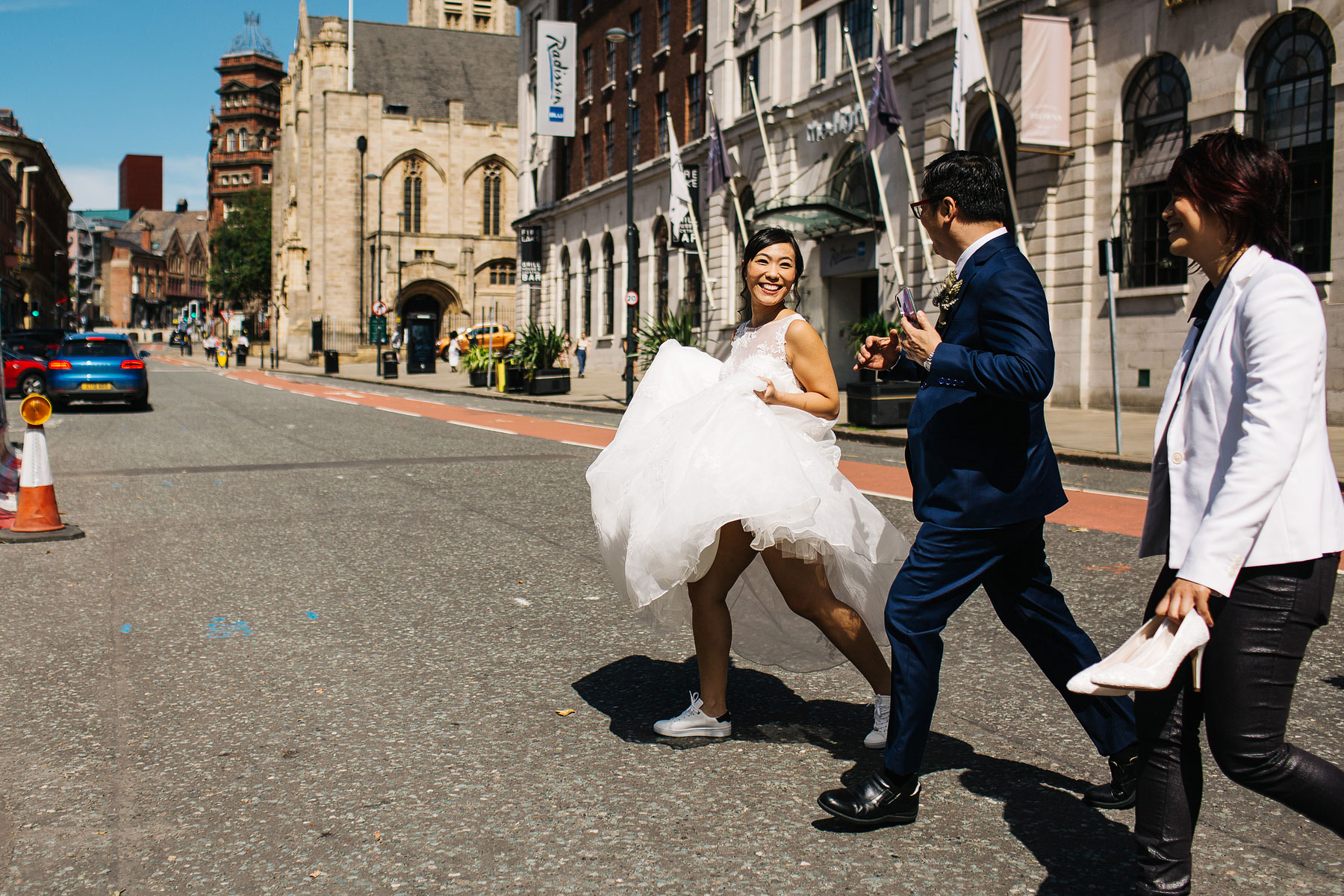 bride walking through the streets of sunny leeds