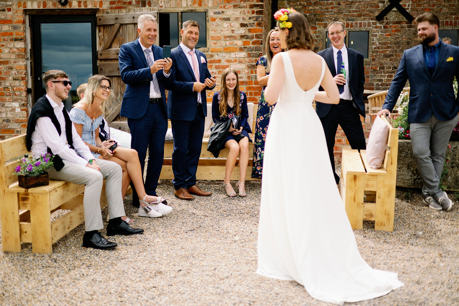 happy guests with bride at a barn wedding in yorkshire