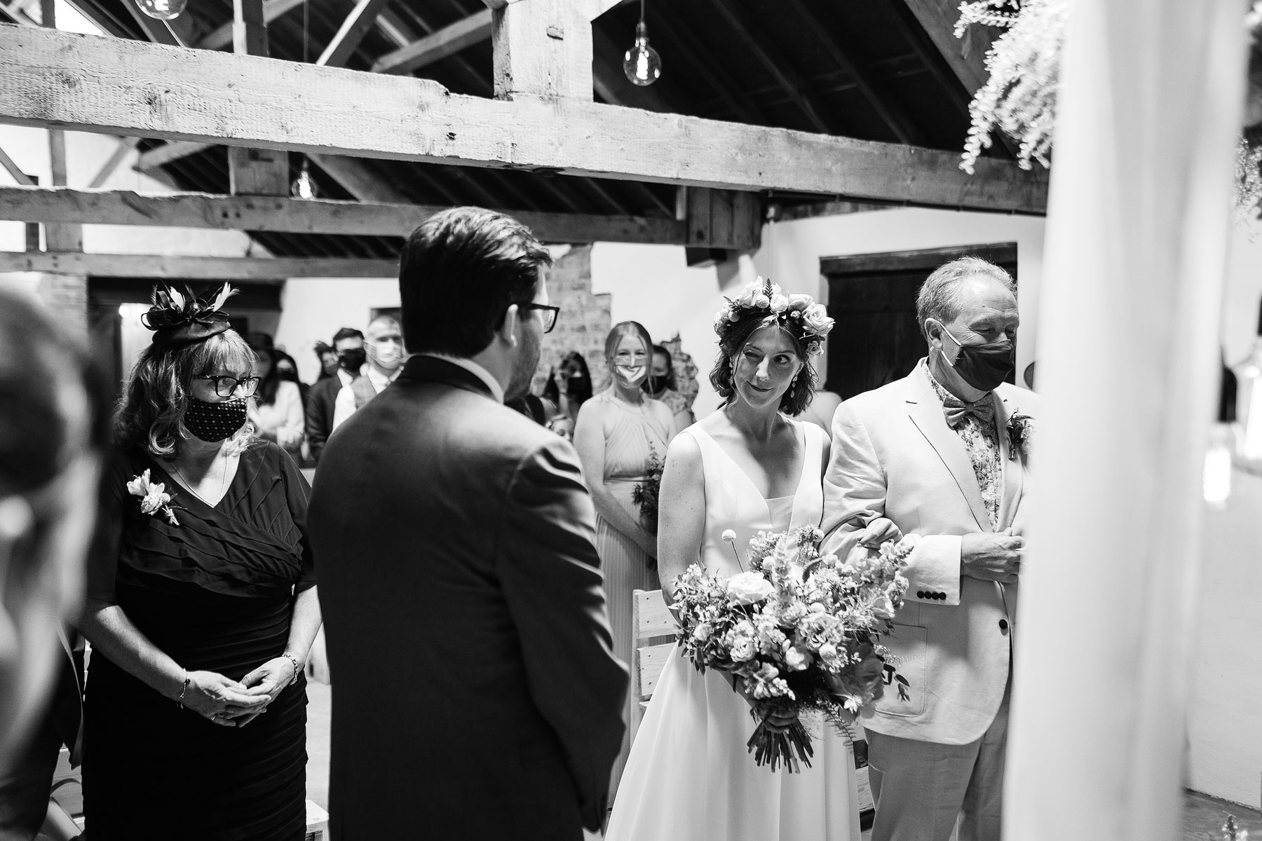 bride sees groom at woolas barn wedding venue