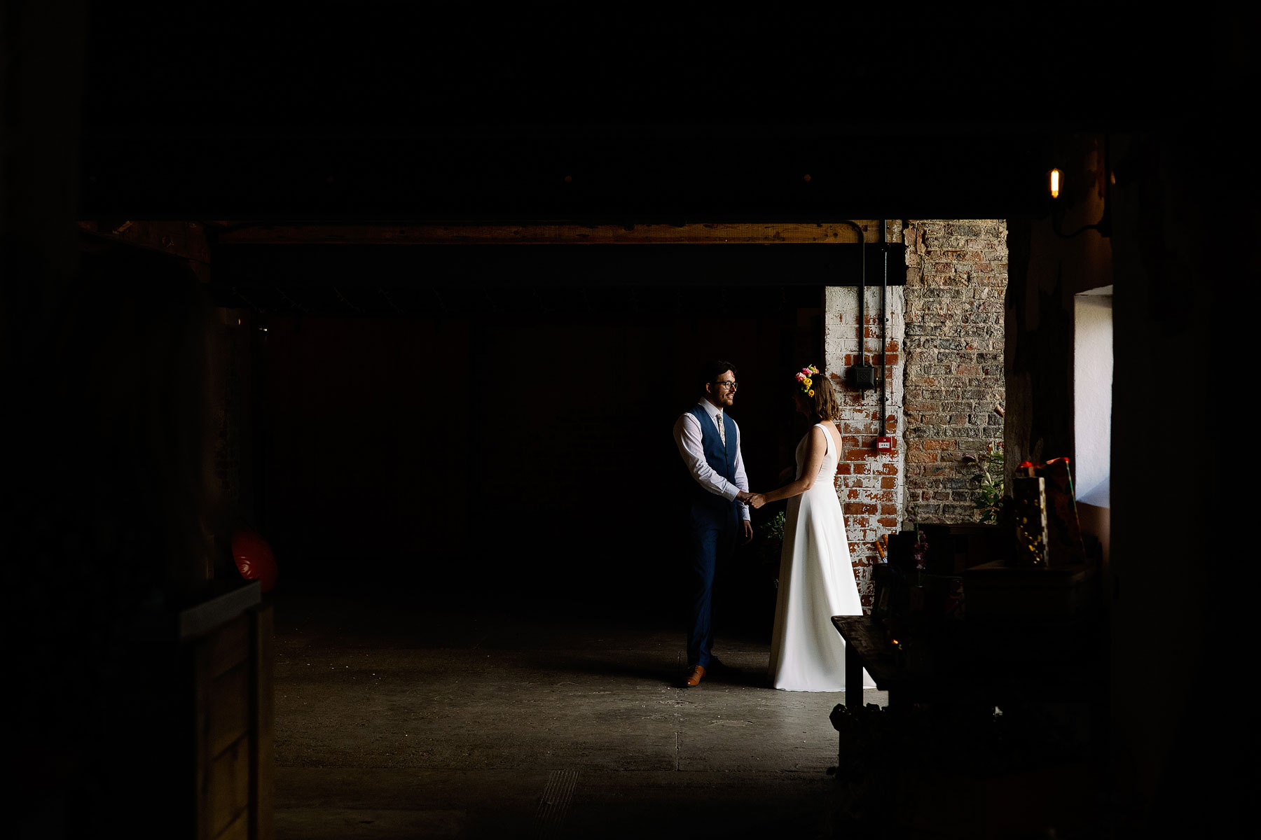 bride and groom portrait in a barn in yorkshire