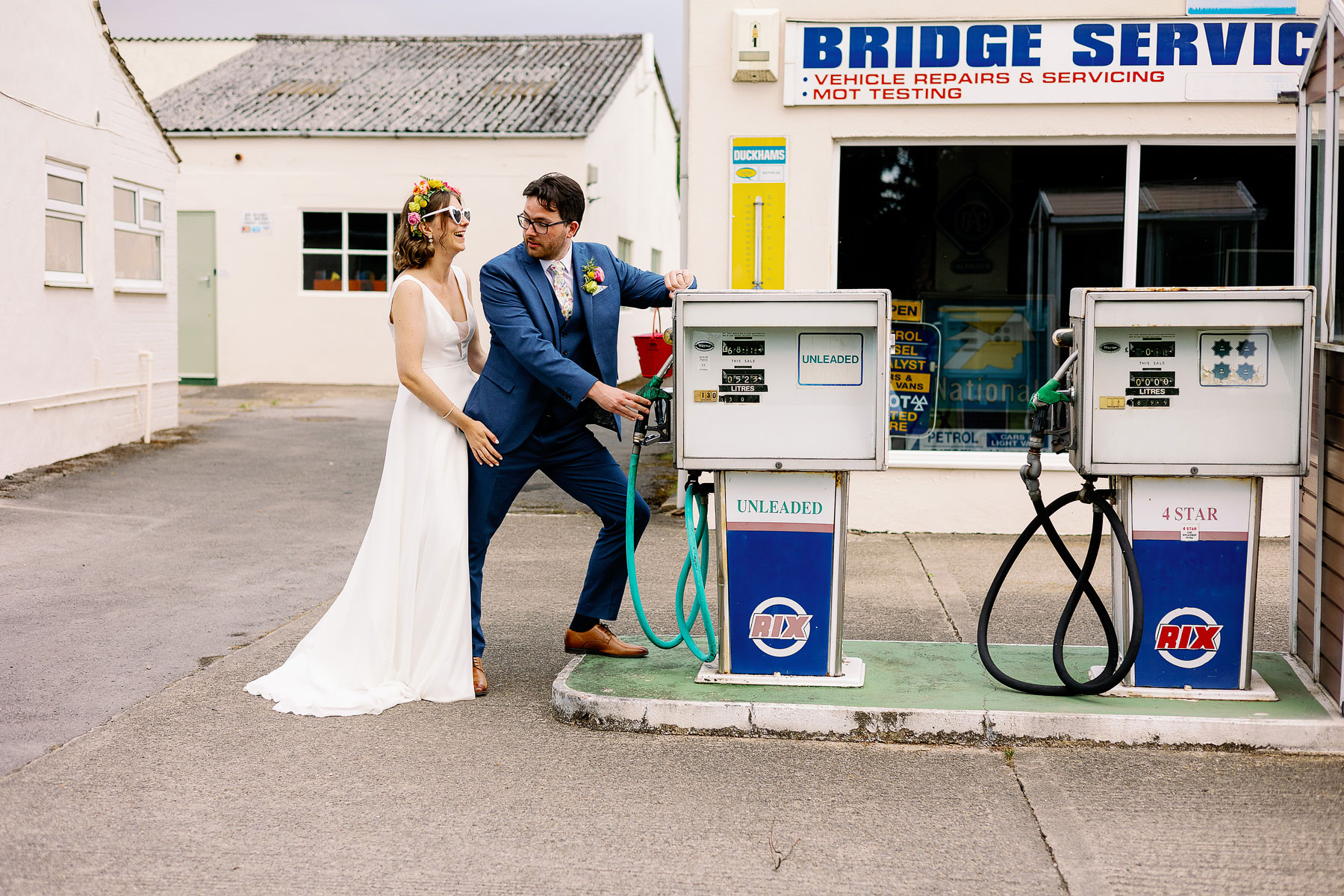 bride and groom portraits at an old petrol station