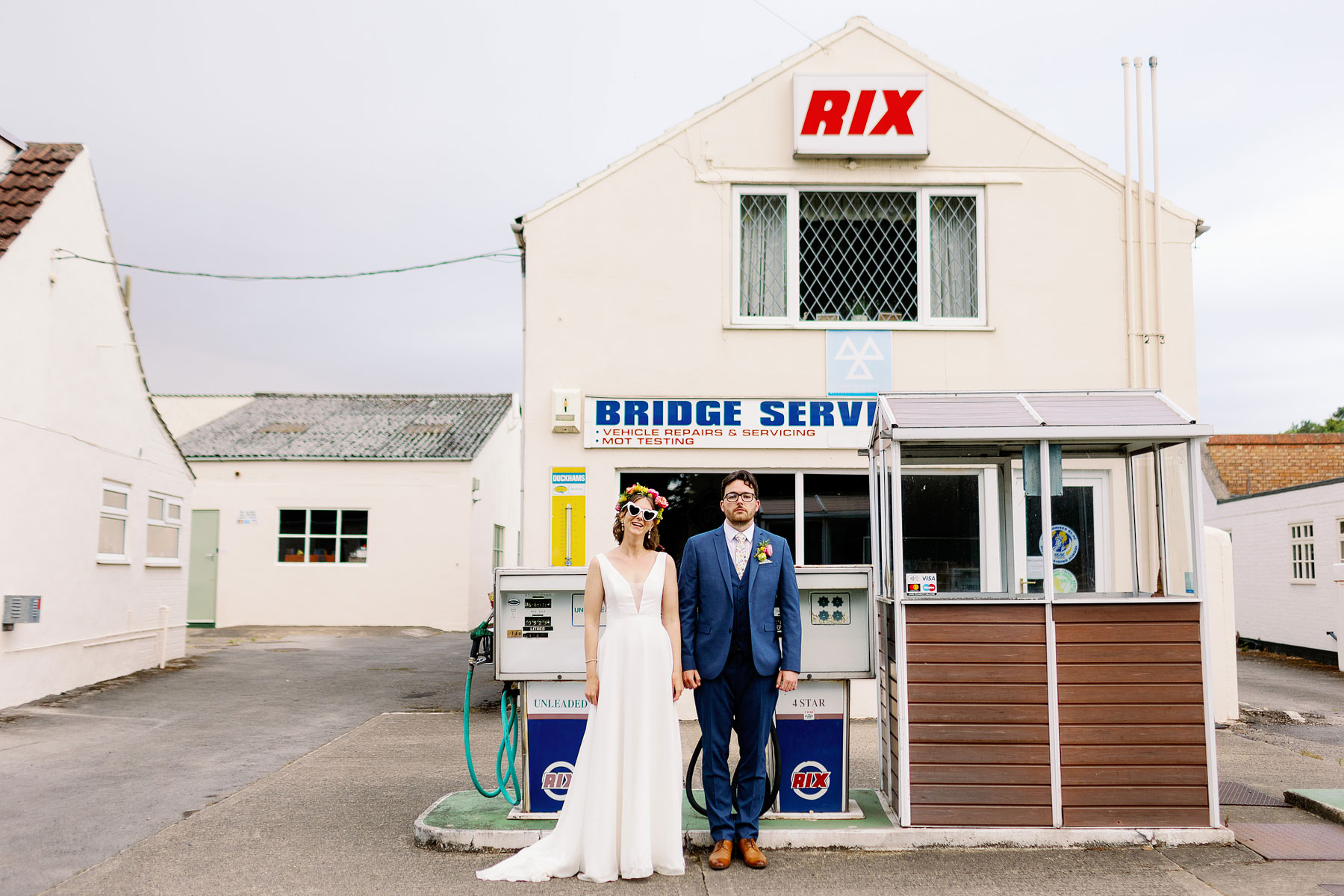bride and groom portraits at an old petrol station