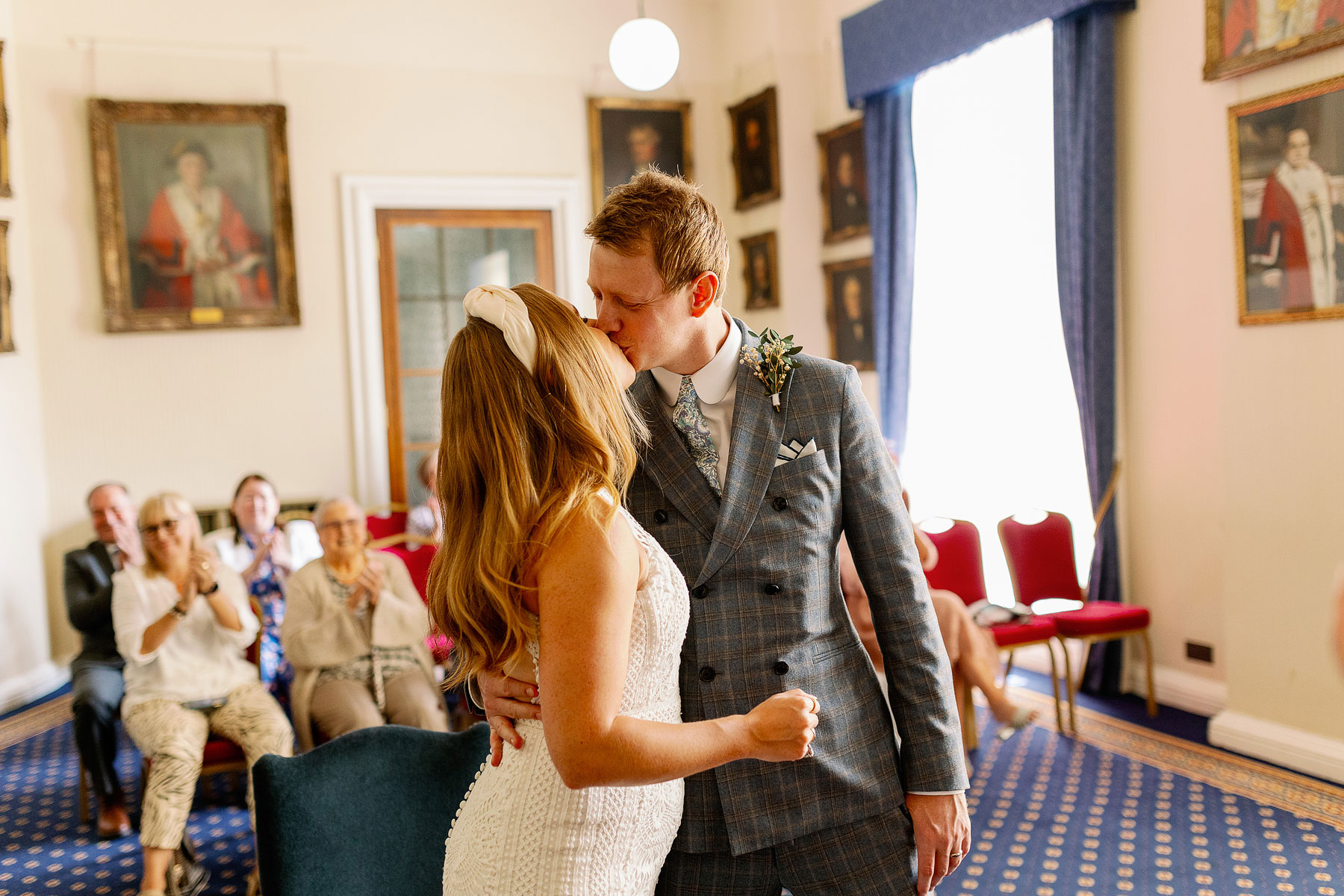 Bride and groom kissing after getting married in Leeds Civic Hall West Room