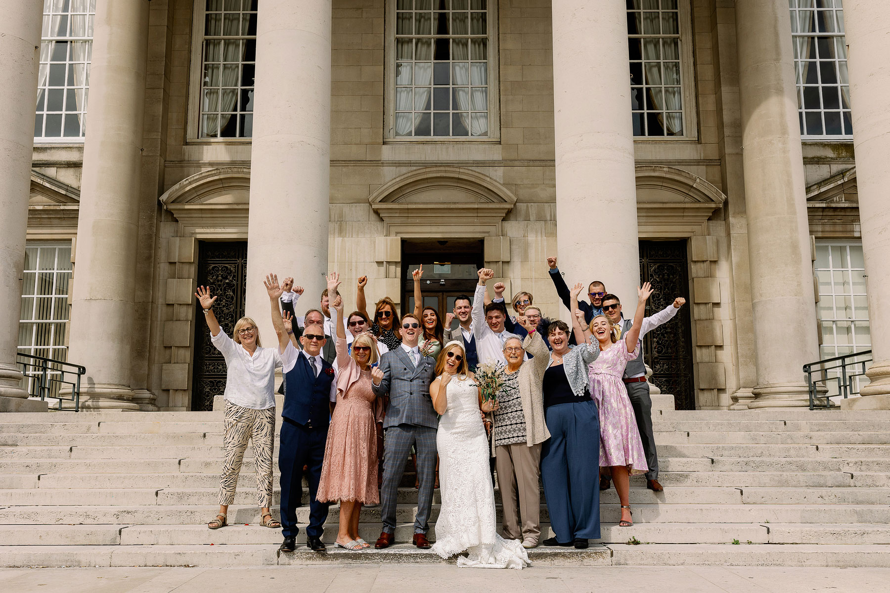 Group photograph of all the guests at a micro wedding at leeds civic hall