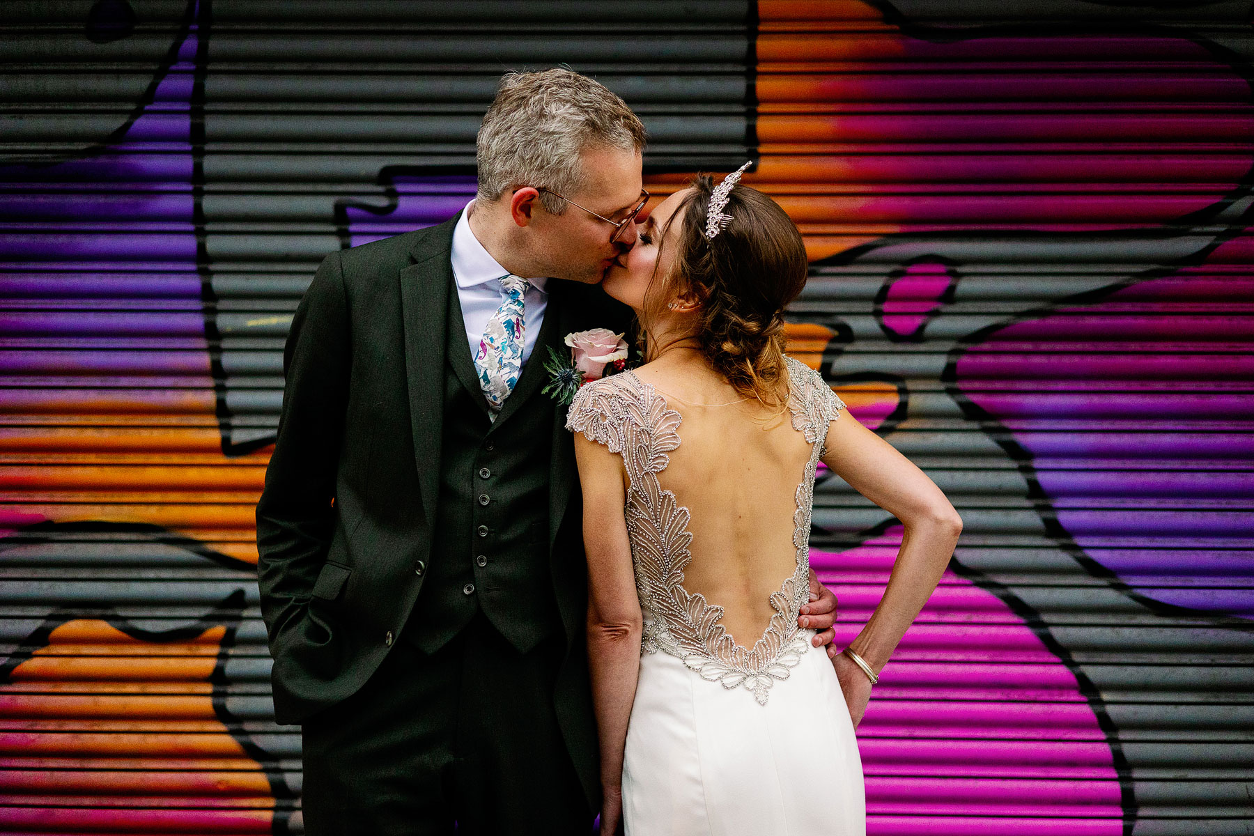 colourful wedding images in leeds with a bride wearing backless dress