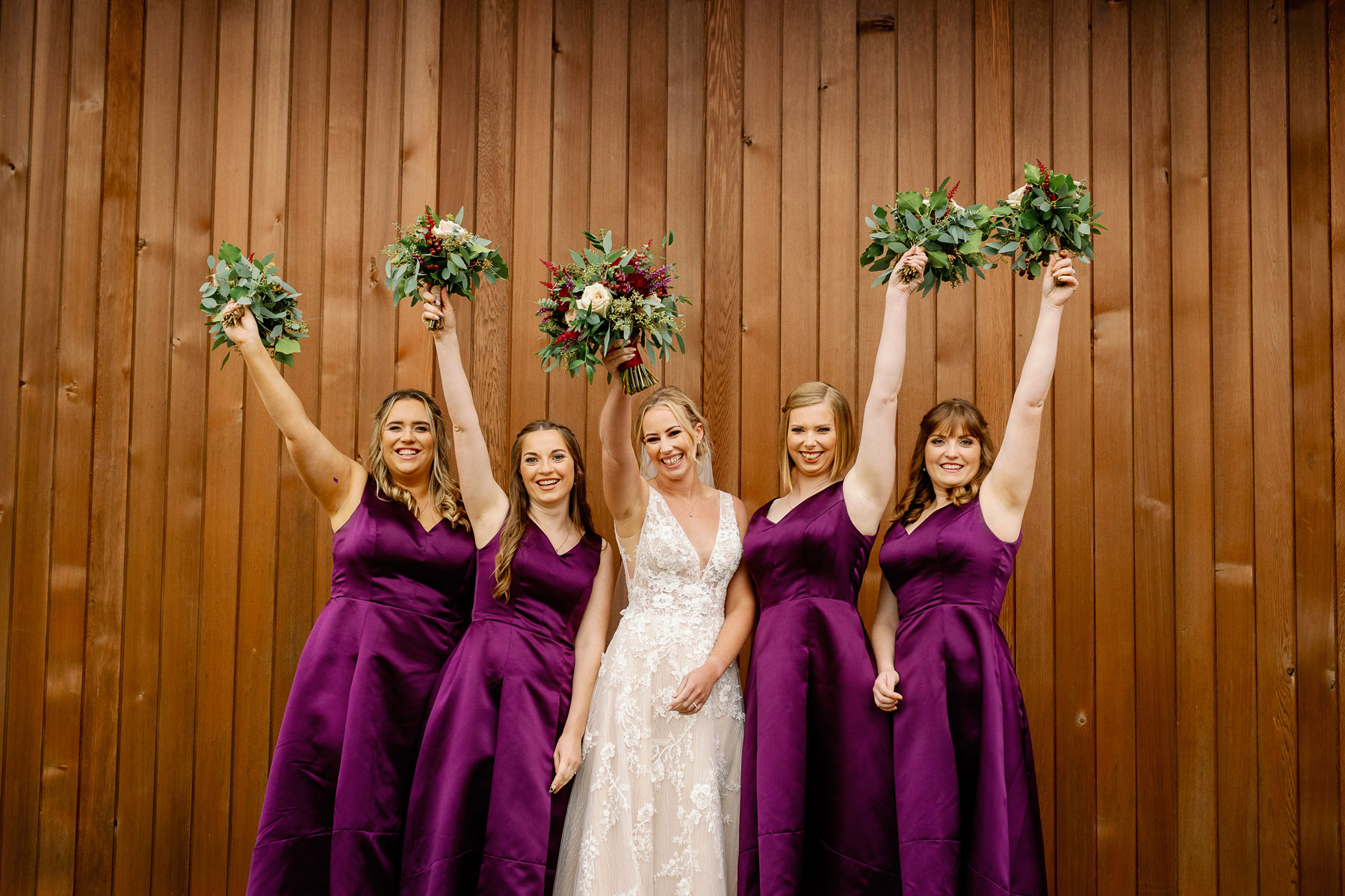 Bridesmaids wearing deep purple 