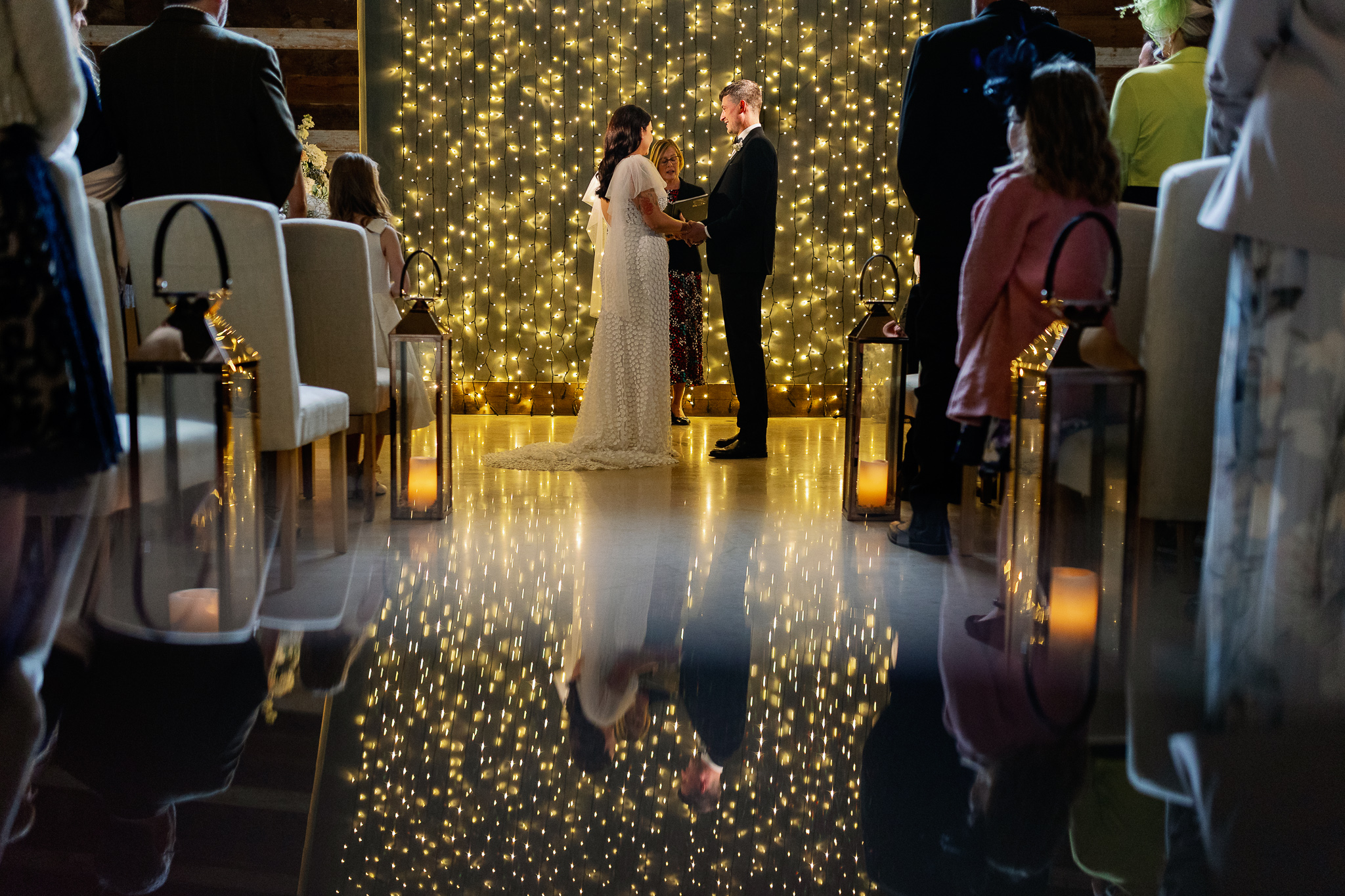 Getting married in front of a string of lights