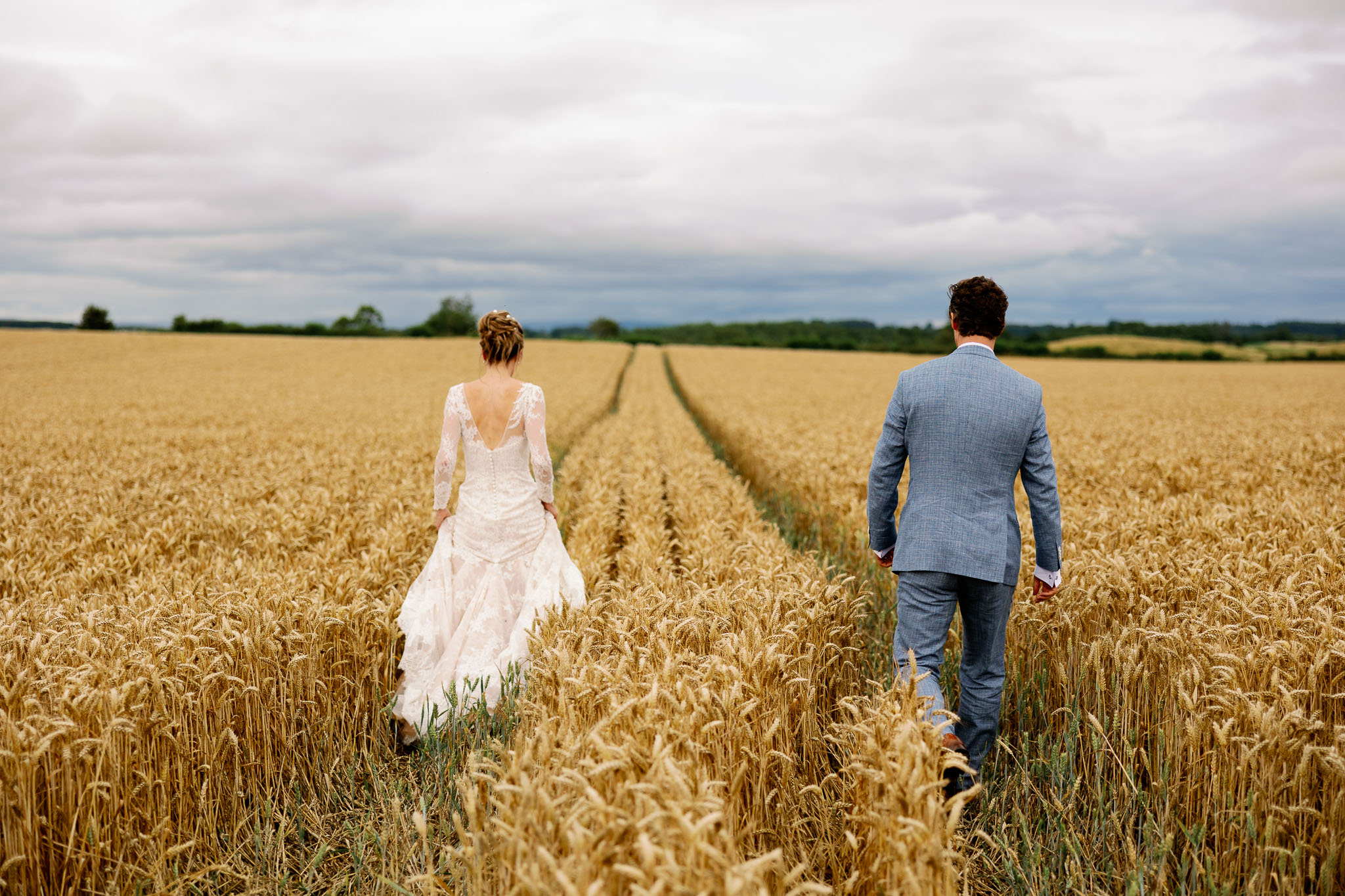 Bride and groom in a cornfield on their wedding day