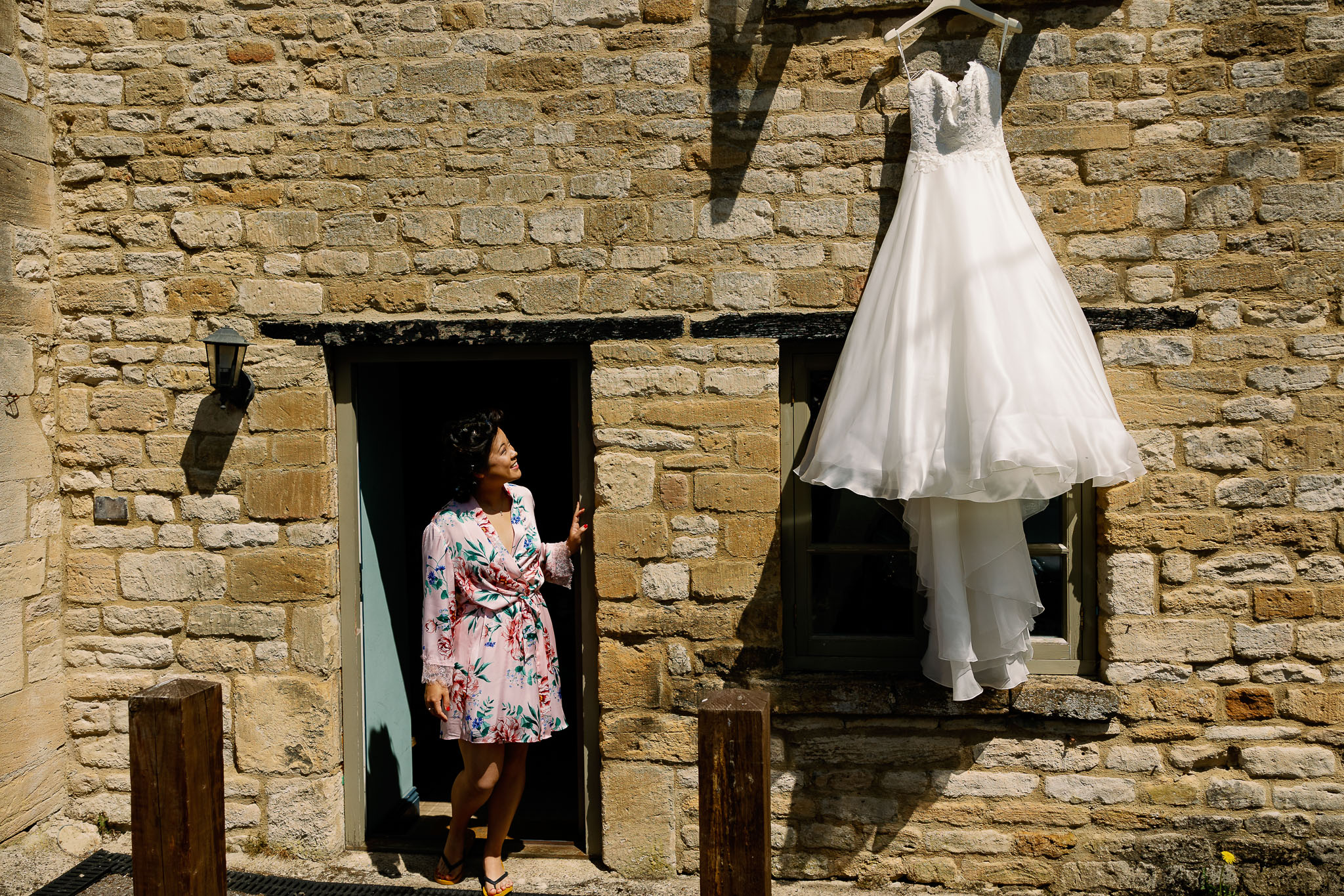 Bride looking at her Caroline Castigliano Wedding Dress