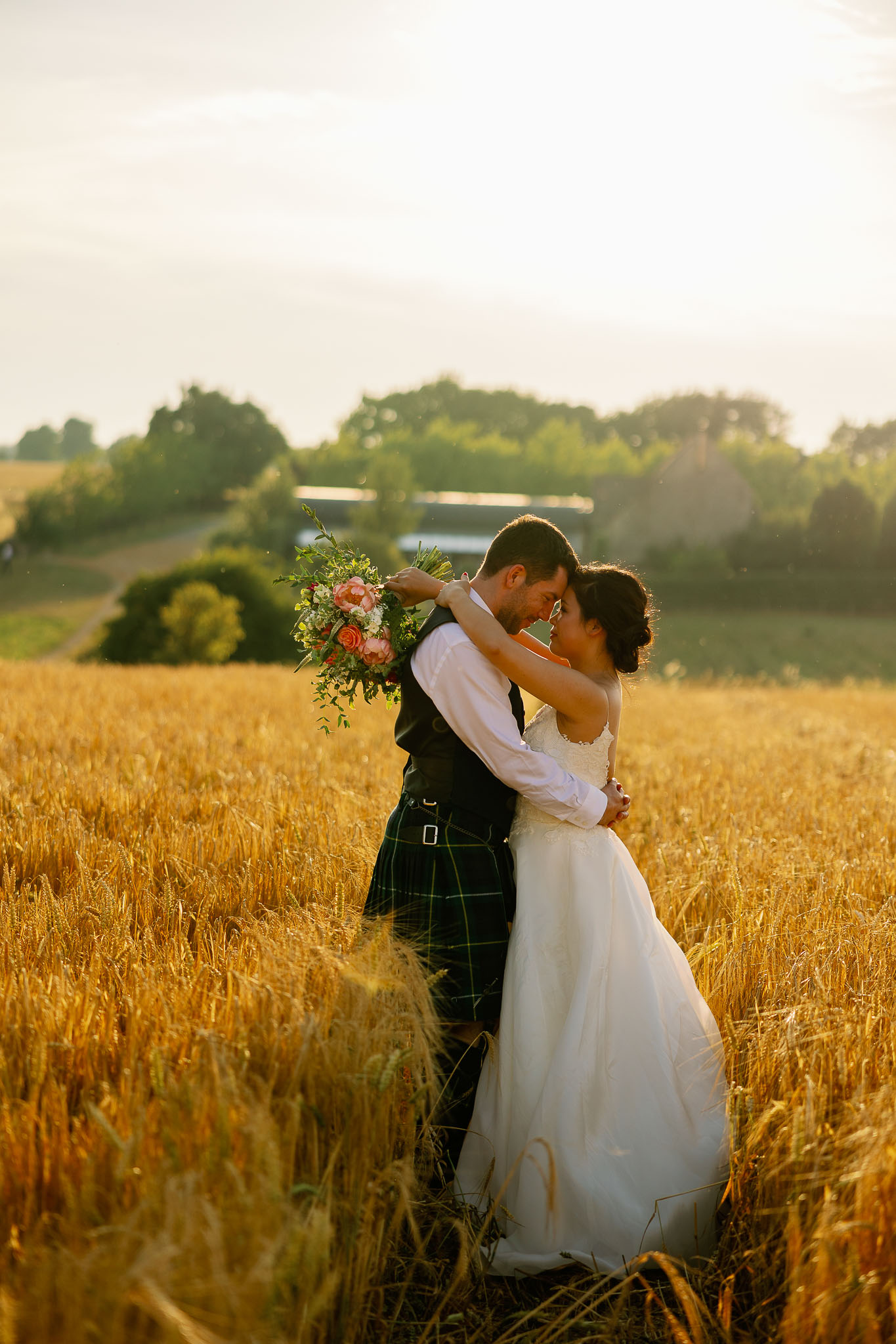 Beautiful wedding pictures of a couple in a corn field