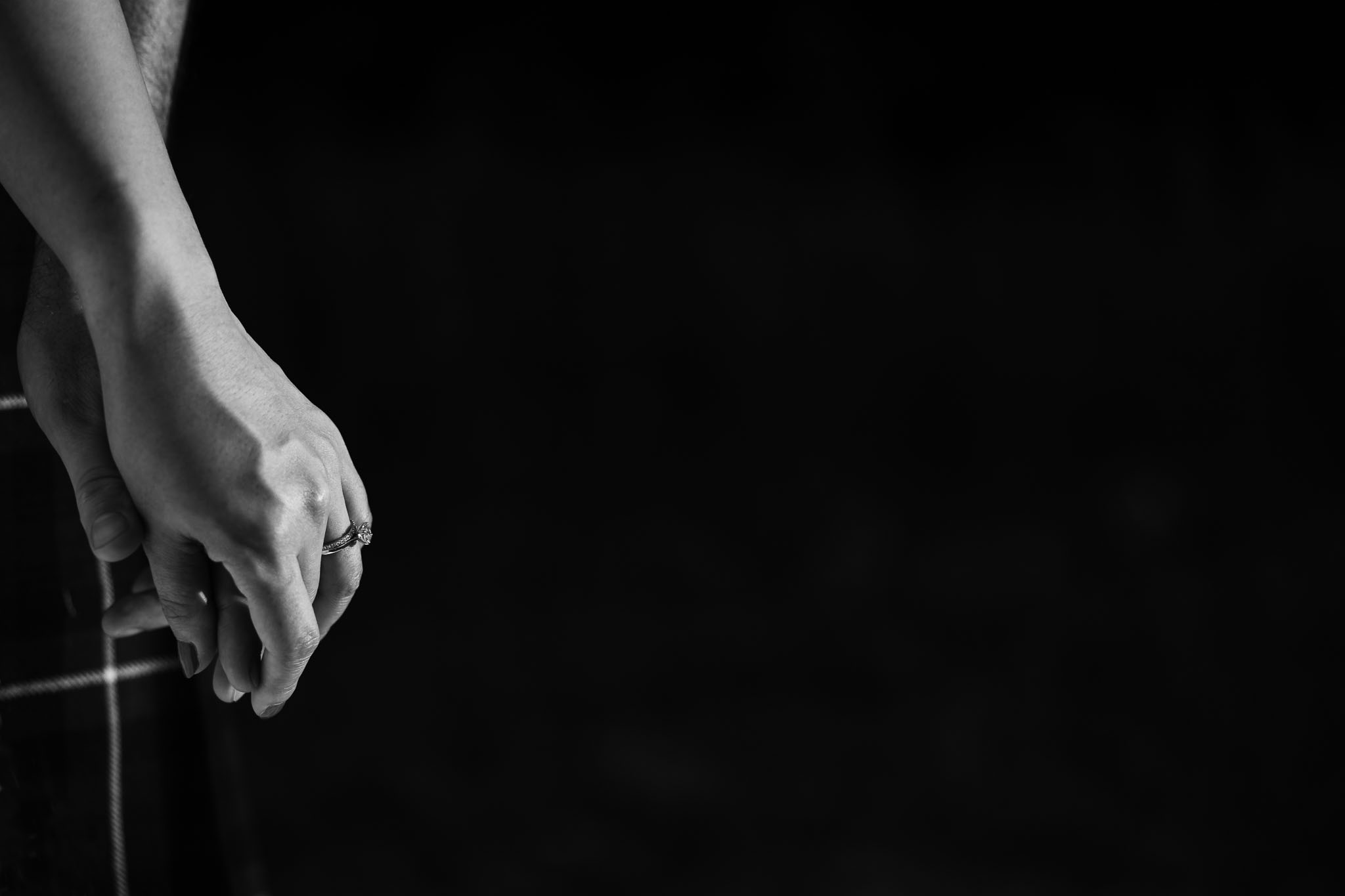 picture of a hand with a wedding ring in black and white 