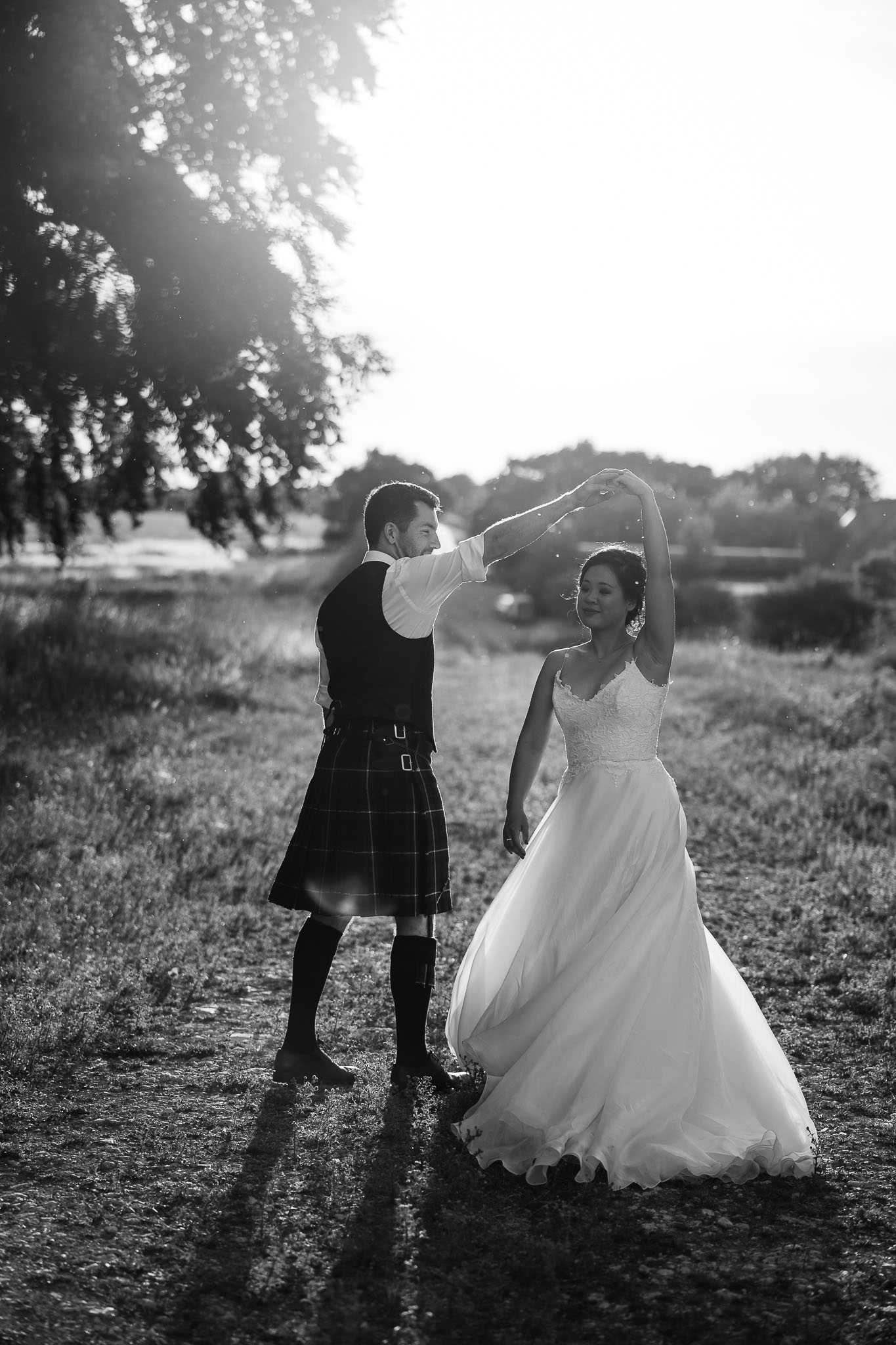 Dancing in a field on a wedding day