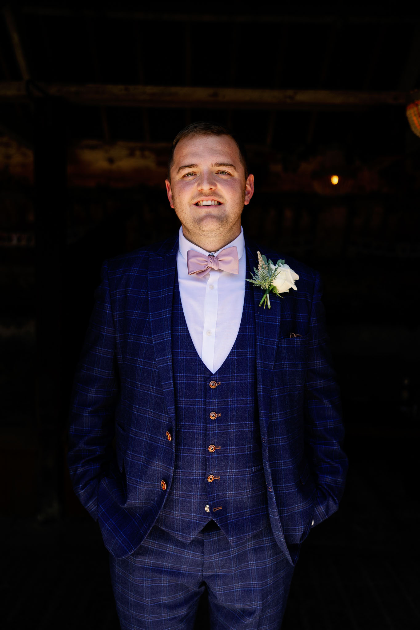 Groom wearing check print on his wedding day in Yorkshire