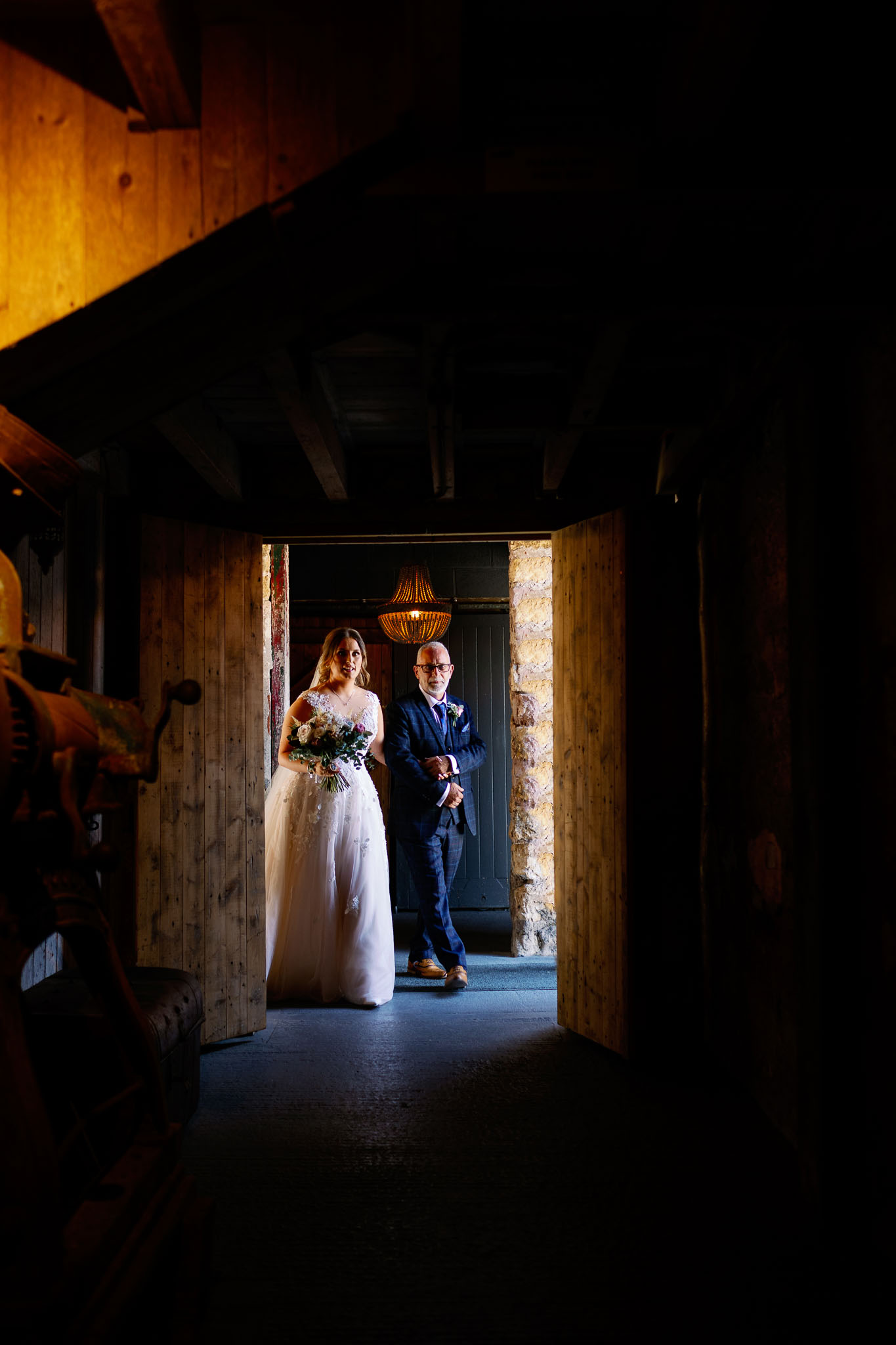 Bride walking the aisle at her North Yorkshire Barn Wedding 